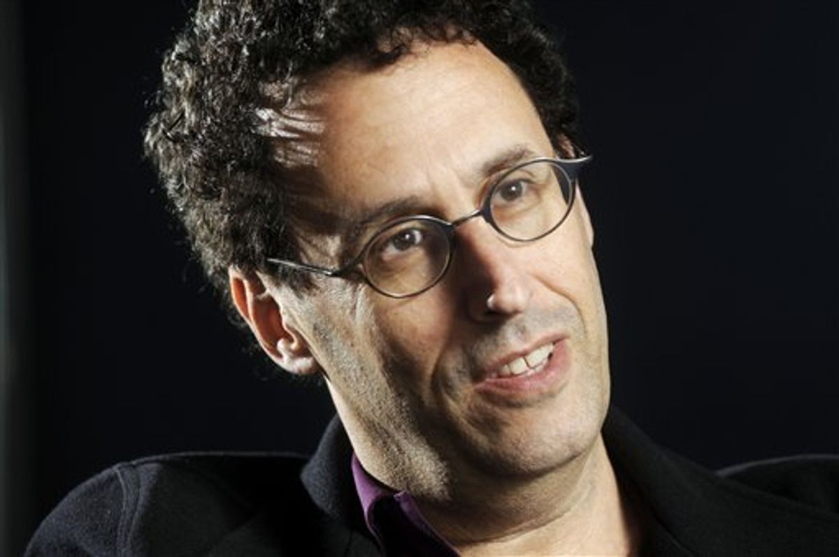 FILE - In this April 30, 2009 photo, Tony Kushner is shown during a break from rehearsal of his new play at the Guthrie Theatre in Minneapolis, Minn.,  Kushner won a Pulitzer Prize for "Angels in America," his epic play about the AIDS epidemic, and is a New York literary fixture who has received more than a dozen honorary degrees from American colleges and universities.  So it was a shock when the Board of Trustees of the City University of New York voted last month to withhold a promised honorary degree after a trustee said the playwright was anti-Israel. CUNY later backtracked under a barrage of criticism, and Kushner will accept his degree on Friday, June 2, 2011. (AP Photo/Craig Lassig)  (AP)