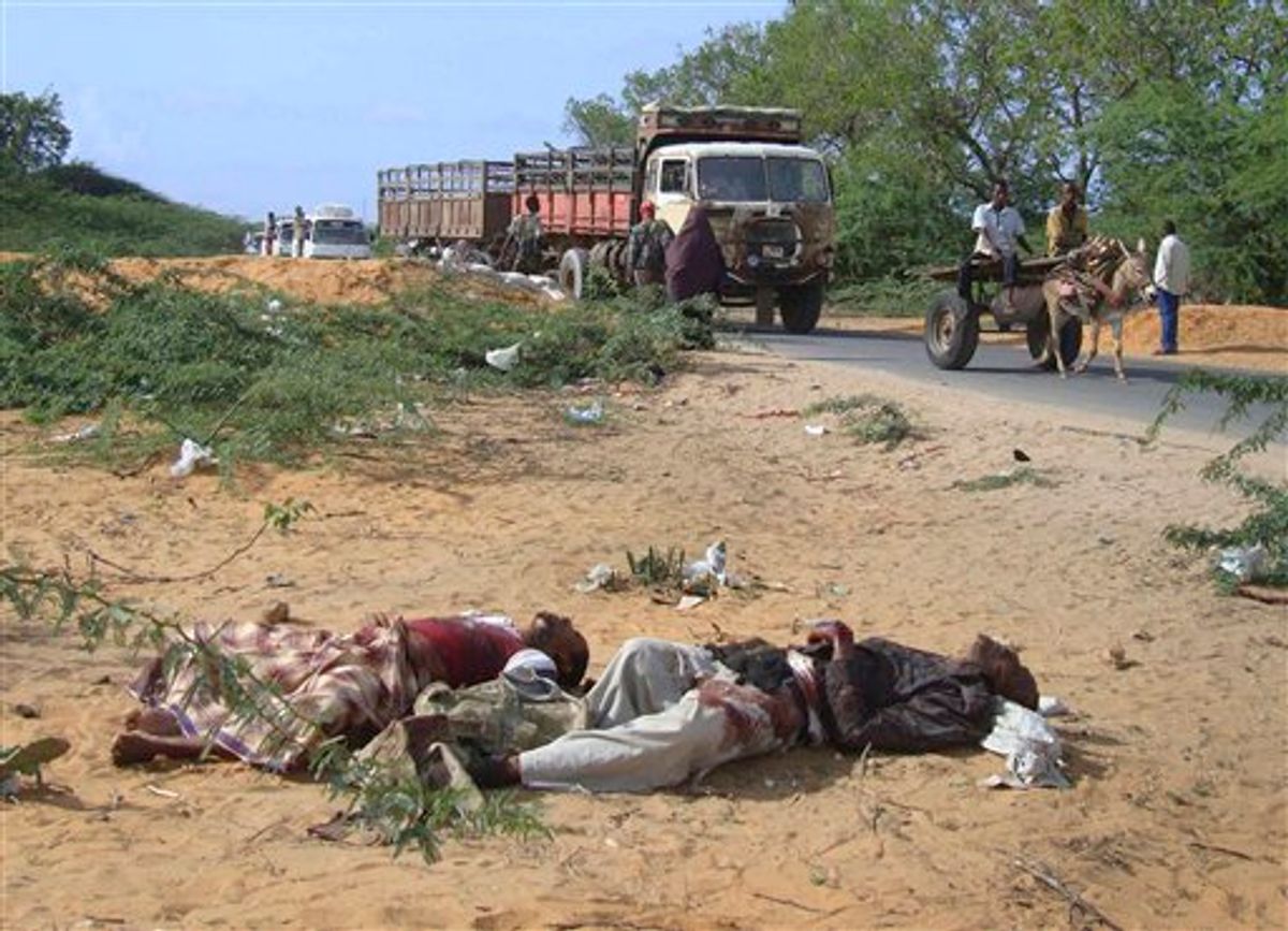EDS NOTE: GRAPHIC CONTENT - This photo taken Wednesday, June 8, 2011 shows Fazul Abdullah Mohammed, left, and another unidentified man lying dead in Mogadishu, Somalia.  A Somali official says the al-Qaida operative behind the 1998 U.S. Embassy bombings in Kenya and Tanzania has been killed. The spokesman for Somalia's minister of information, Abdifatah Abdinur, said Saturday June 11, 2011 that officials have concluded that a man security forces killed late Tuesday was Fazul Abdullah Mohammed. Fazul had a $5 million bounty on his head for allegedly planning the 1998 embassy bombings. (AP Photo/Farah Abdi Warsameh) (AP)