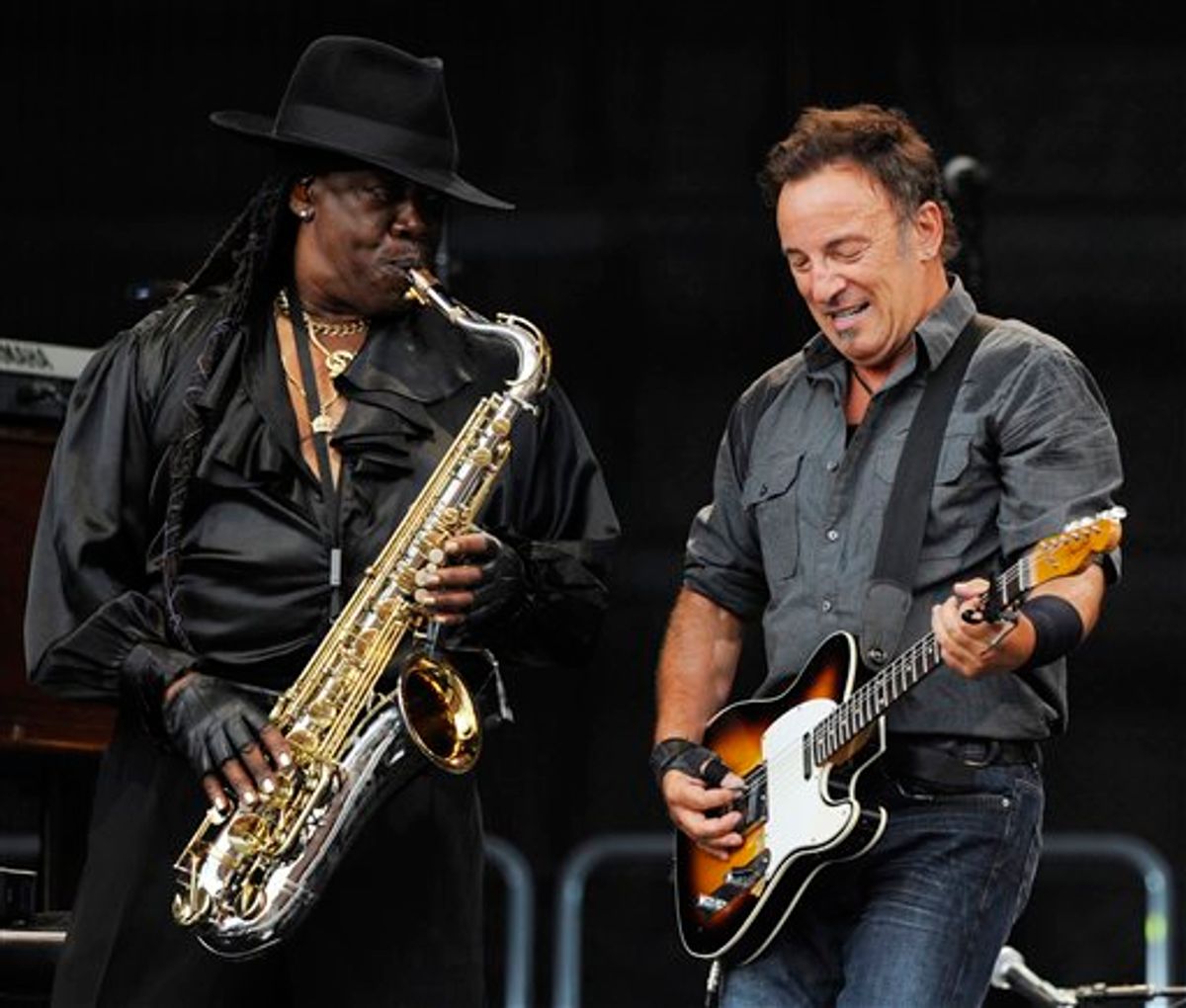 FILE - In this July 2, 2009 file photo, U.S. rock singer Bruce Springsteen, right, and saxophonist Clarence Clemons  perform during the first German concert of his "Working On A Dream" European tour in the Olympic stadium in Munich, Germany.  A person who has worked with Clemons in the past confirmed Sunday night, June 12, 2011 that Clemons has suffered a stroke. (AP Photo/Christof Stache, File) (AP)