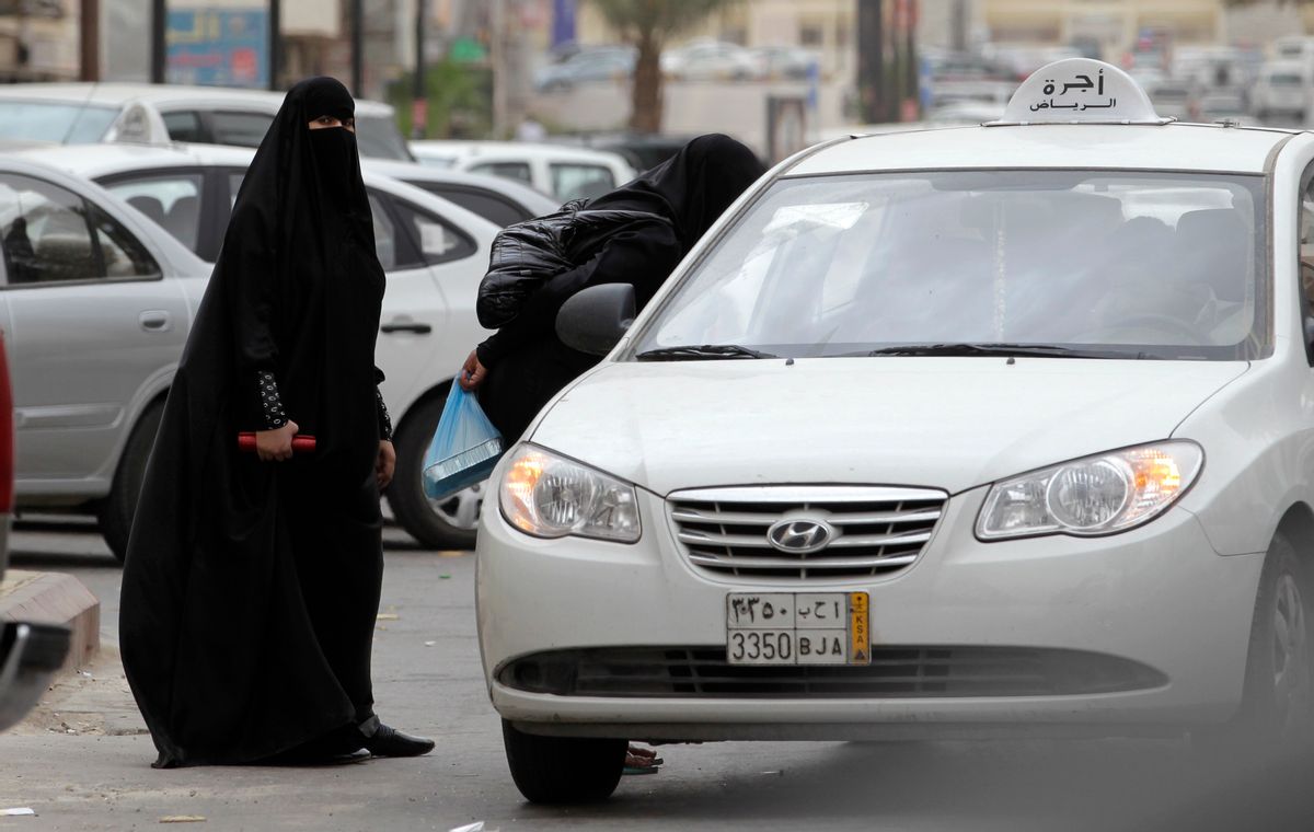 FILE - In this Tuesday, May 24, 2011 file photo, Saudi women board a taxi in Riyadh, Saudi Arabia. A campaign to defy Saudi Arabia's ban on women driving opened Friday, June 17, 2011 with female motorists getting behind the wheel, including one who took a 45-minute tour through the nation's capital, amid calls for sustained challenges to the restrictions in the ultraconservative kingdom. (AP Photo/Hassan Ammar, File) (Associated Press)