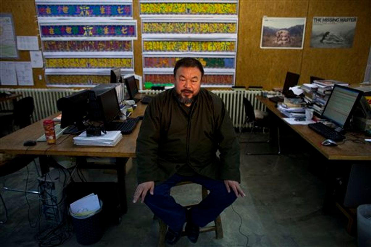In this Jan. 21, 2010 photo, artist Ai Weiwei speaks during an interview at his studio in Beijing, China.  Chinese state media say renowned activist artist Ai Weiwei has been released on bail after confessing to tax evasion. The Xinhua News Agency says Ai's poor health was also a factor in his release Wednesday, June 22, 2011. (AP Photo/Alexander F. Yuan) (AP)