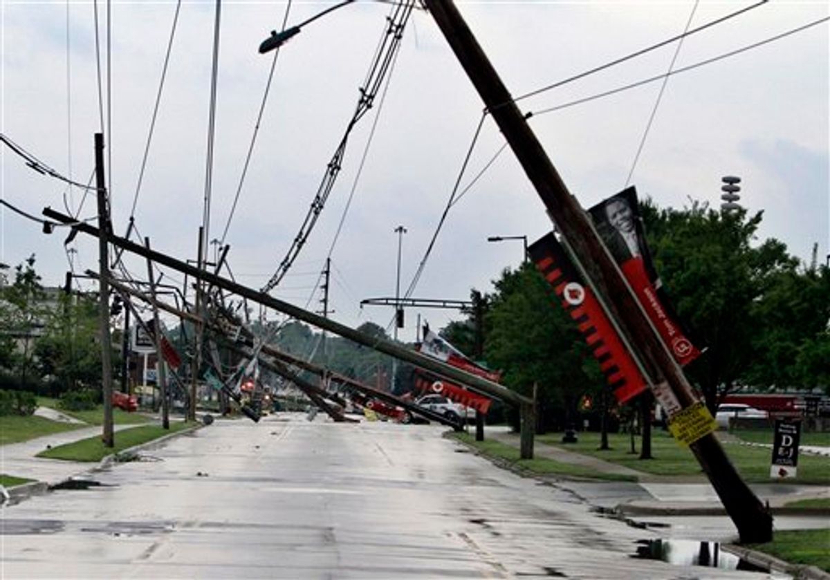 A row of electric power poles snapped along Floyd Street at Central Avenue in front of Cardinal Stadium at the University of Louisville in Louisville, Ky., Wednesday, June 22, 2011 after an apparent tornado moved through the area. At least five barns were damaged and horses were running loose Wednesday at Churchill Downs, home of the Kentucky Derby, after a powerful storm that spawned tornadoes blew through Louisville. (AP Photo/Garry Jones) (AP)