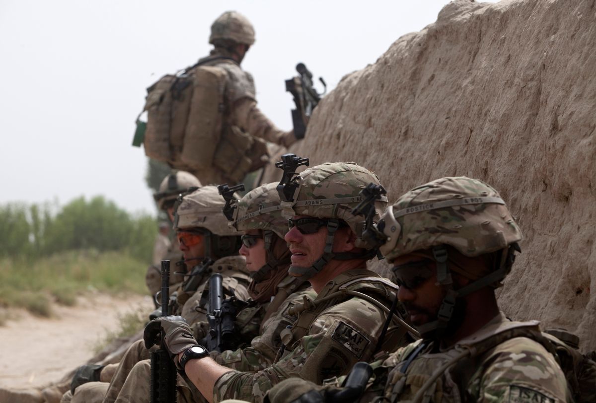 Canadian and U.S. army soldiers attached to 1st Battalion, 22nd royal regiment rest during a patrol in the Panjwai district of Kandahar province in southern Afghanistan June 26, 2011. Canada is winding up combat operations in Afghanistan and all combat troops will leave by the end of July, after nearly ten years fighting in Afghanistan. U.S. President Barack Obama also said on June 22 he would pull 10,000 troops from Afghanistan by year's end, followed by about 23,000 more by the end of next summer and a steady withdrawal of remaining troops after that.
 REUTERS/Baz Ratner (AFGHANISTAN - Tags: CONFLICT POLITICS)        (Reuters)