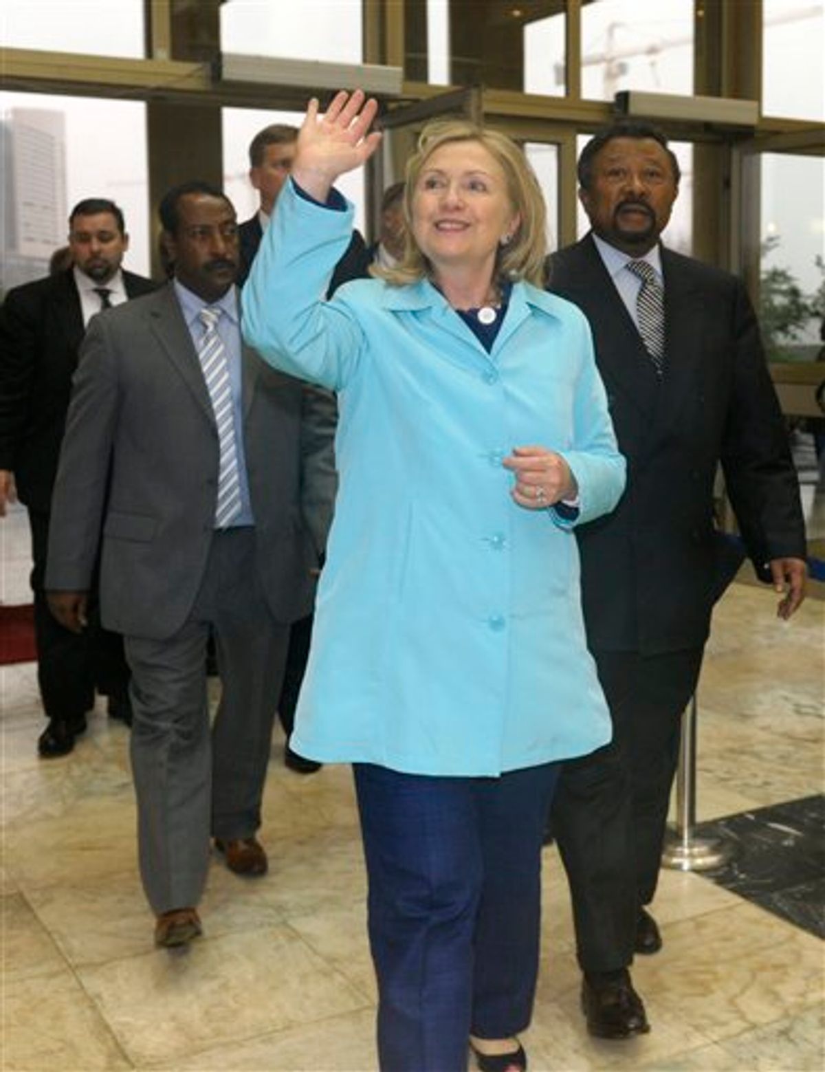 Secretary of State Hillary Rodham Clinton waves as she arrives and meets African Union Commission Chairperson Jean Ping, right, at the African Union headquarters in Addis Ababa, Ethiopia, Monday, June 13, 2011.  (AP Photo/Susan Walsh, POOL) (AP)