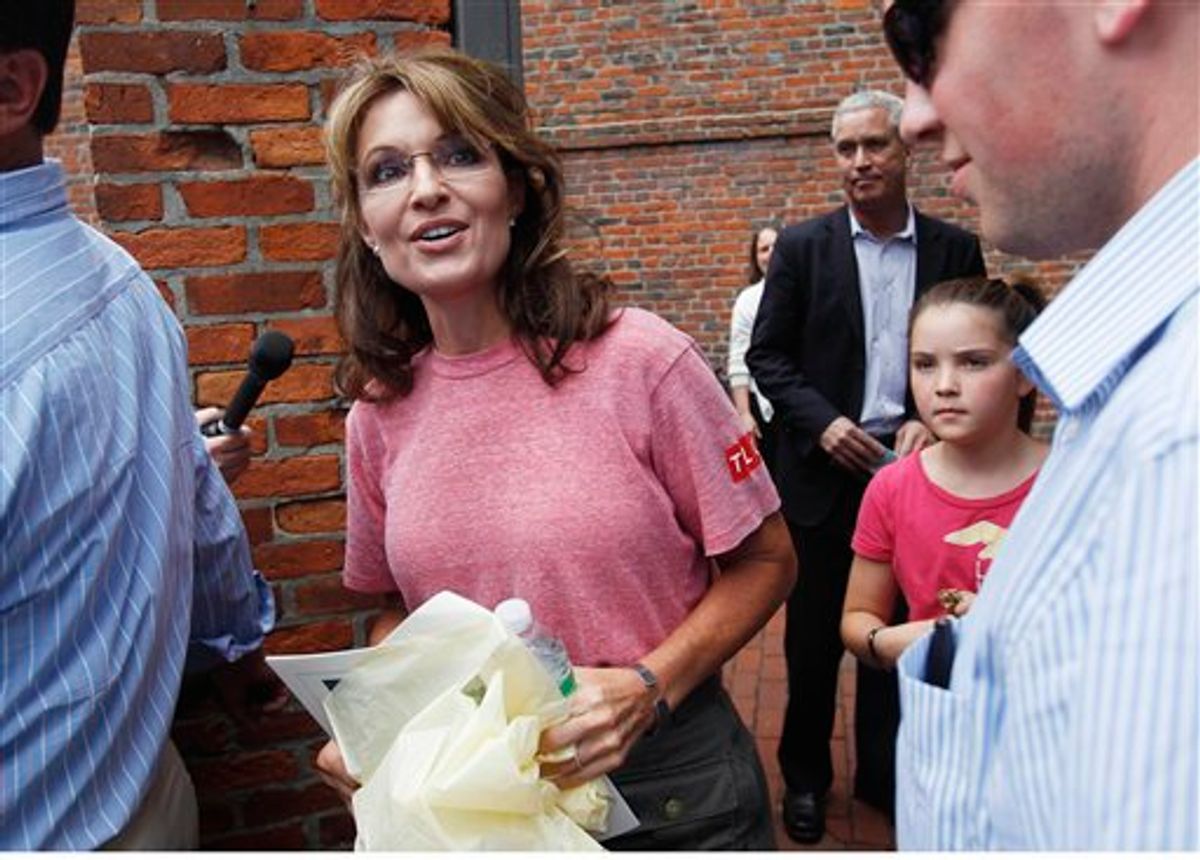 Former Alaska Gov. Sarah Palin, accompanied by her youngest daughter Piper, right, tours Boston's North End neighborhood, Thursday, June 2, 2011. (AP Photo/Steven Senne) (AP)