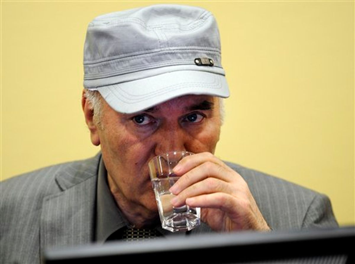 Former Bosnian Serb Gen. Ratko Mladic drinks water in the court room during his initial appearance at the U.N.'s Yugoslav war crimes tribunal in The Hague, Netherlands, Friday, June 3, 2011. Mladic's appearance Friday at the Yugoslav war crimes tribunal in The Hague is his first public appearance since he went into hiding nearly 16 years ago, when he was indicted for genocide and war crimes committed in the 1992-95 Bosnian war. (AP Photo/ Martin Meissner, Pool) (AP)