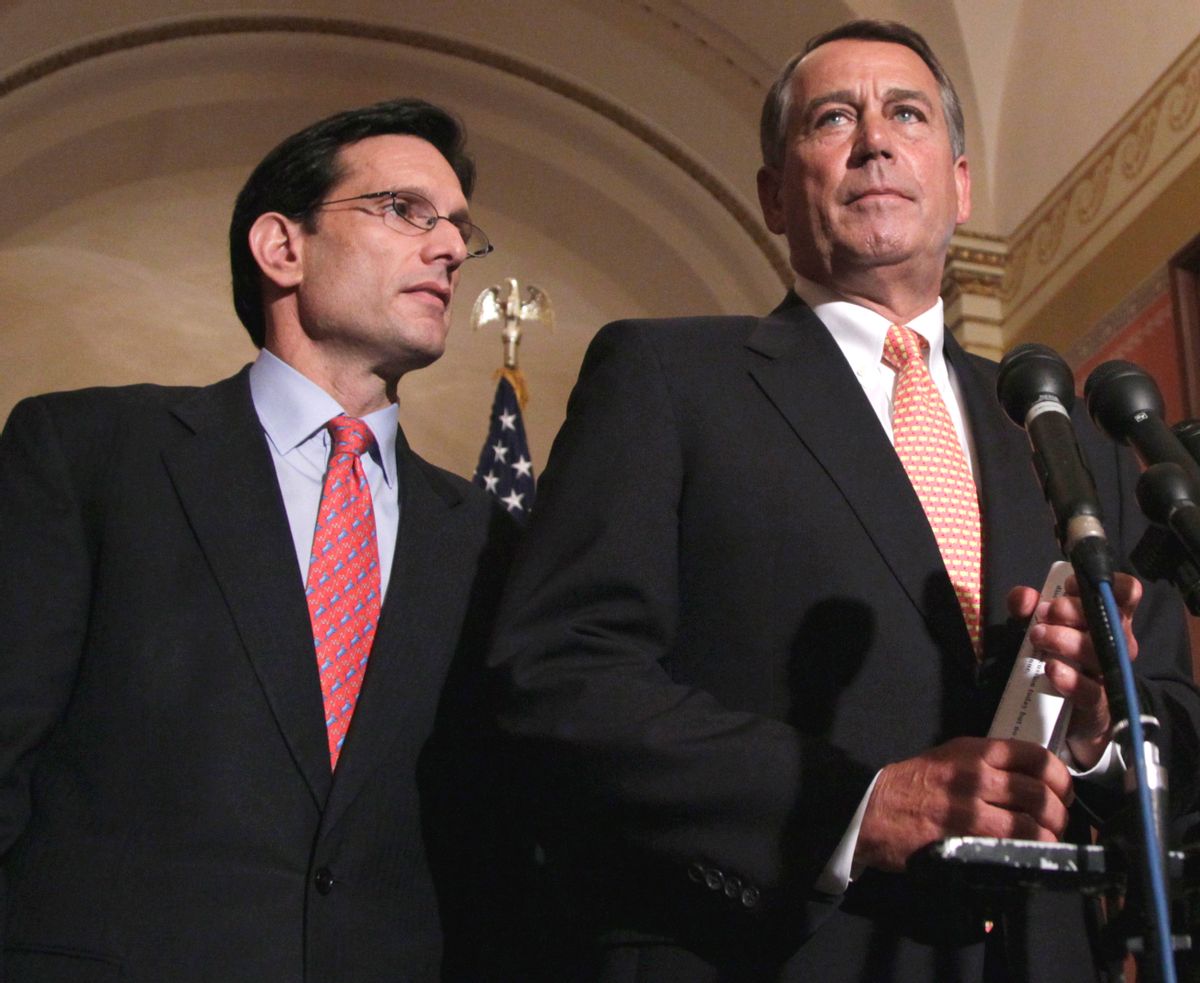 House Speaker John Boehner of Ohio, right, accompanied by House Majority Leader Eric Cantor of Va., speaks during a news conference on Capitol Hill in Washington, Tuesday, April 5, 2011.  (AP Photo/Carolyn Kaster) (Associated Press)