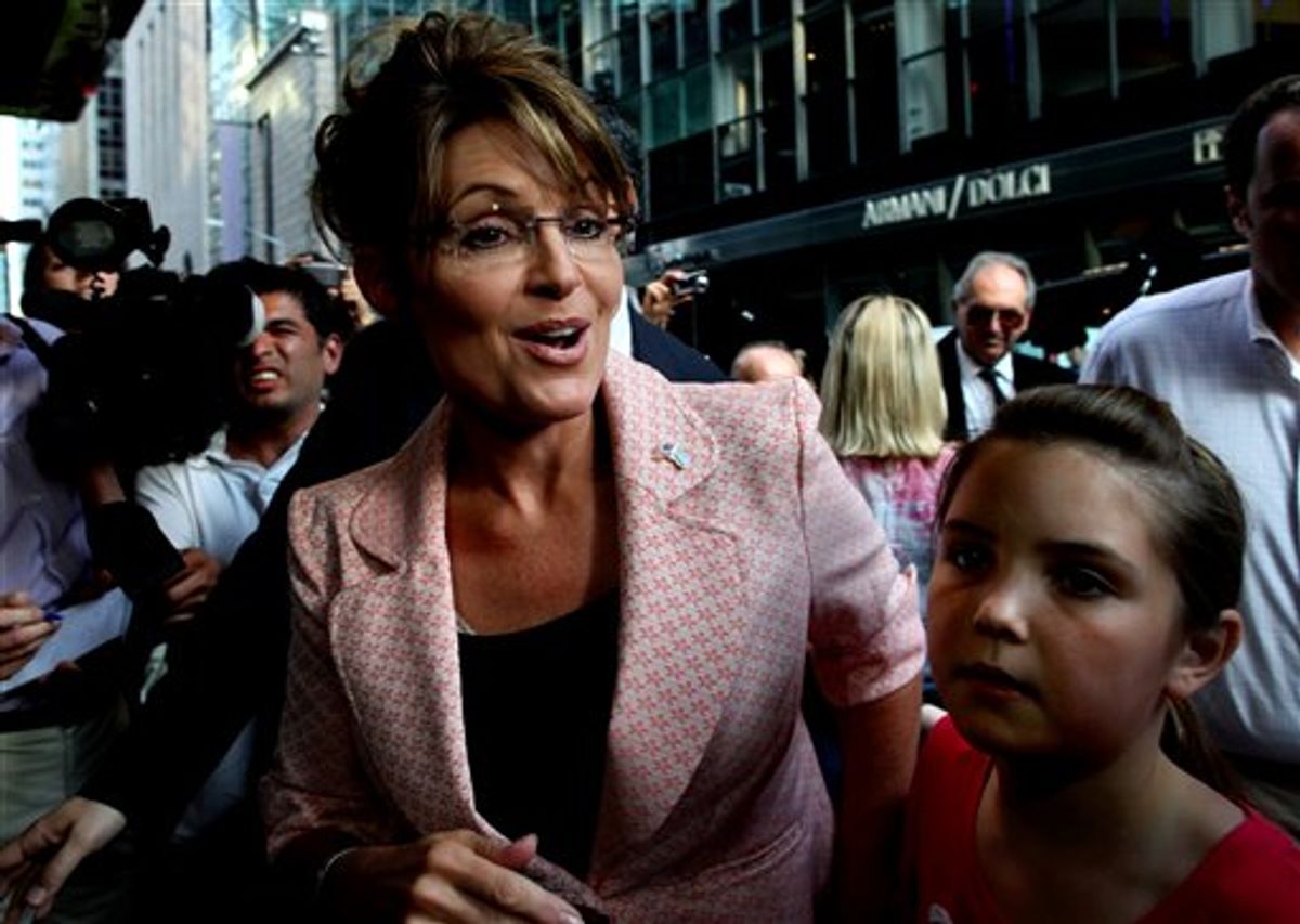 FILE - In this May 31, 2011 file photo, former Alaska Gov. Sarah Palin walks to the door of Trump Tower for a scheduled meeting with Donald Trump in New York. Thousands of Palin's emails from her first two years as governor are being released by the state of Alaska, a disclosure that has taken on national prominence as she flirts with a run for the presidency.  (AP Photo/Craig Ruttle, File) (AP)