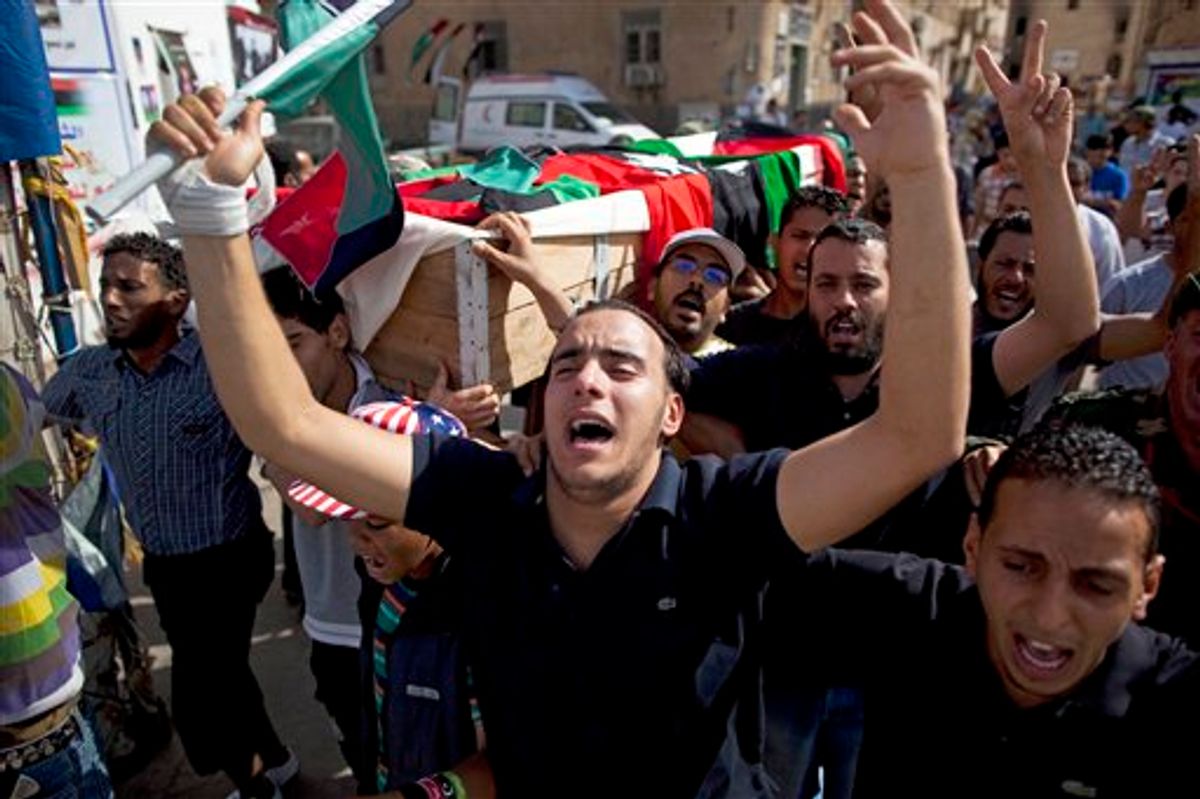 People carry the coffin of a rebel fighter killed on the front line against Moammar Gadhafi's forces during his burial next to the Transitional National Council headquarters in rebel stronghold Benghazi, Libya, Saturday, May 4, 2011. (AP Photo/Rodrigo Abd) (AP)