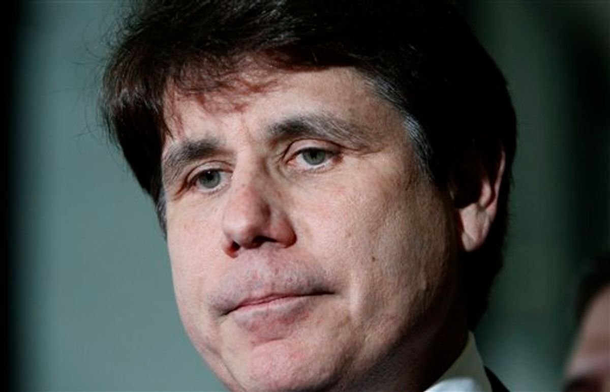 FILE - In this June 9, 2011 file photo, former Illinois Gov. Rod Blagojevich pauses as he talks with reporters at the Federal Court building after the judge handed the case to the jury in his corruption trial in Chicago. Jurors deliberating in Blagojevich's corruption trial told a judge on Monday, June 27, 2011, that they have reached a verdict on 18 of the 20 counts against him, and attorneys in the case have agreed that the verdict should be read. (AP Photo/Charles Rex Arbogast, File) (AP)