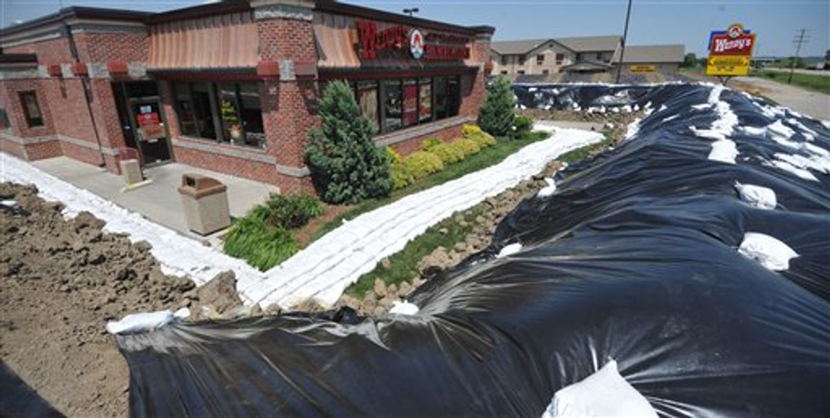 A Wendy's restaurant is surrounded by a temporary berm Monday June 6, 2011 in Hamburg, Iowa. The southwest Iowa town is under a mandatory evacuation order as the Missouri River continues to rise. (Photo/Dave Weaver) (AP)