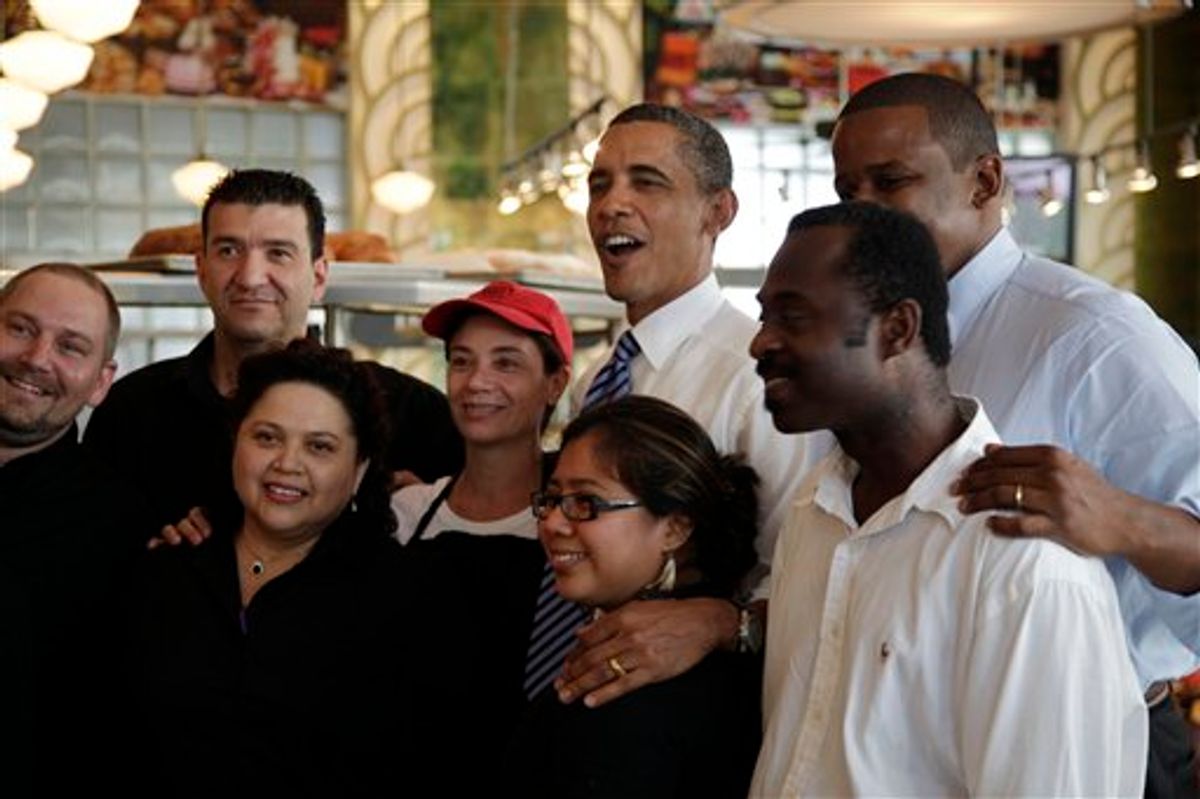 FILE - President Barack Obama, center, and Rep. Kendrick Meek, D-Fla., second from right, pose for photos at Jerry's Famous Deli after a fundraiser for Florida Democrats, in this Aug. 18, 2010 file photo taken in Miami Beach, Fla. President Barack Obama has problems in Florida that he didn't have when he won the pivotal swing state in 2008. The challenges show why Obama has been a frequent visitor to the Sunshine State. (AP Photo/Carolyn Kaster, FILE) (AP)