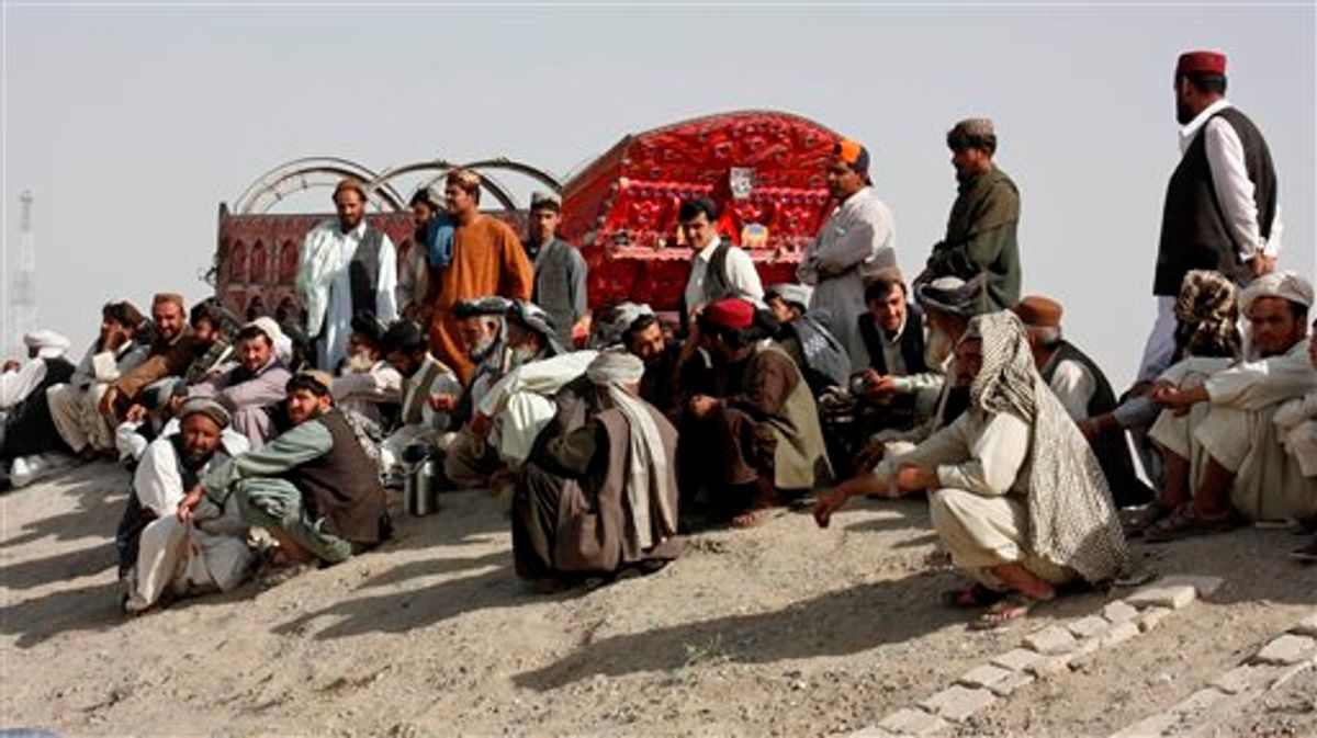 Pakistani truck drivers wait to cross the border to neighboring Afghanistan at the Pakistani border post in Chaman, Friday, June 17, 2011. About 300 Pakistani tribesmen briefly blocked NATO supplies and other traffic at a crossing along the border with Afghanistan on Friday to protest an alleged shooting incident, officials said. (AP Photo/Shah Khalid) (AP)