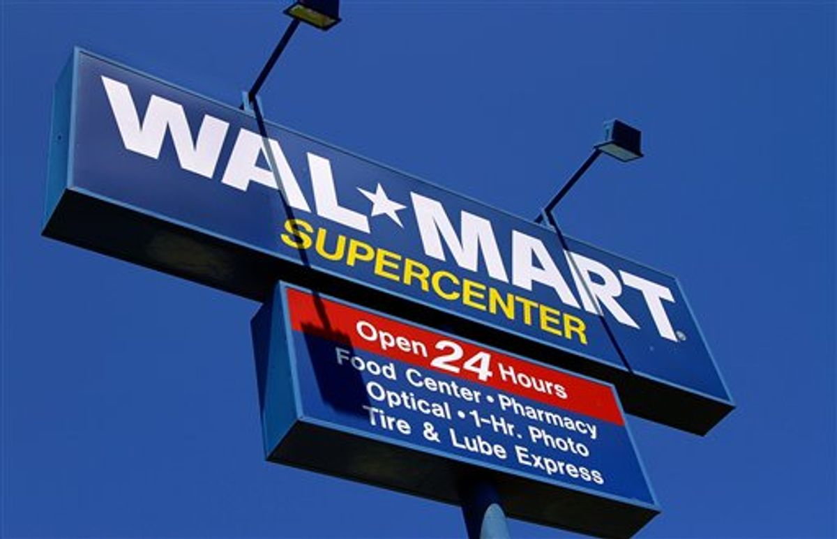 The WalMart Supercenter signage is seen in Springfield, Ill., Monday, May 16, 2011. Wal-Mart Stores Inc. is reporting Tuesday, May 17, a 3 percent increase in first-quarter net income, beating Wall Street expectations because of robust international business and cost controls.  (AP Photo/Seth Perlman)  (AP)
