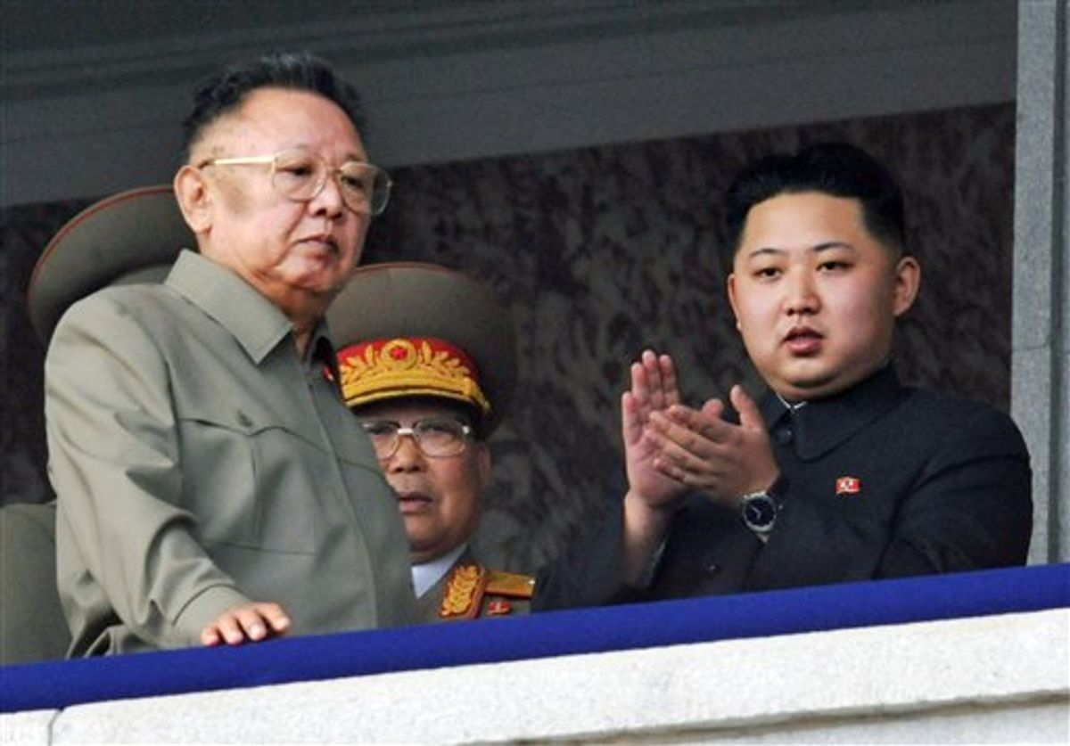 FILE - In this Oct. 10, 2010 file photo Kim Jong Un, right, along with his father and North Korea leader Kim Jong Il, left, attends during a massive military parade marking the 65th anniversary of the ruling Workers' Party in Pyongyang, North Korea.  South Korea's Yonhap News Agency is reporting that the son and heir apparent of North Korean leader Kim Jong Il is visiting China.   The report says Kim Jong Un arrived in the city of Tumen in northeast China on Friday, May 20, 2011. (AP Photo/Kyodo News) JAPAN OUT, MANDATORY CREDIT, NO LICENSING IN CHINA, HONG KONG, JAPAN, SOUTH KOREA AND FRANCE                      (AP)