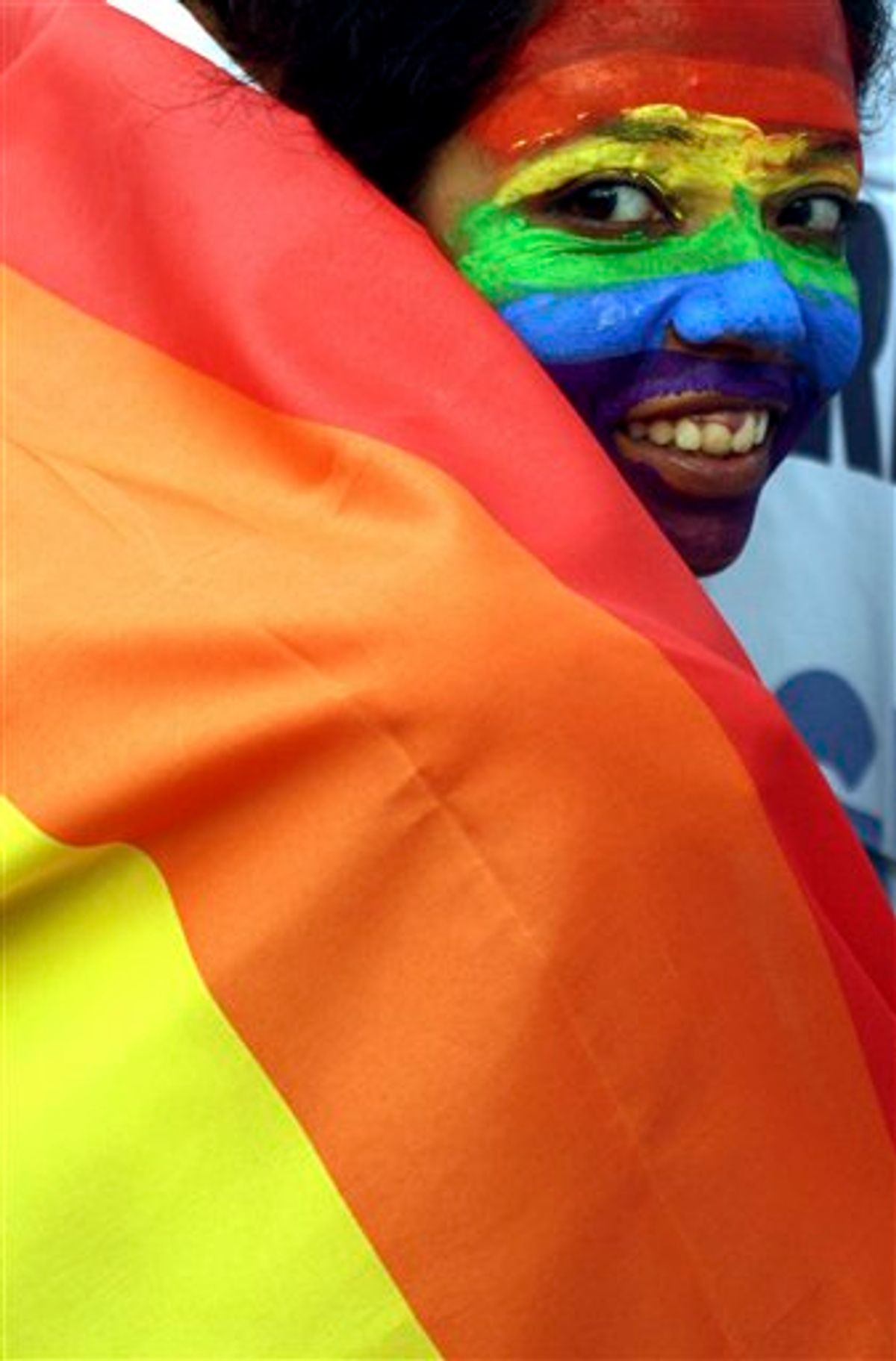 FILE - In this July 2, 2009 file photo, a gay rights activist in Calcutta, India, participates in a rally celebrating the groundbreaking ruling by the Delhi High Court decriminalizing homosexuality. The United Nations issued its first condemnation of discrimination against gays, lesbians and transgender people on Friday, June 17, 2011, in a cautiously worded declaration hailed by supporters as a historic moment. Members of the U.N. Human Rights Council narrowly voted in favor of the resolution put forward by South Africa, against strong opposition from African and Islamic countries. (AP Photo/Sucheta Das, File) (AP)