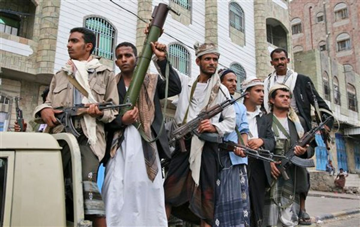 Armed Yemeni tribesmen stand on the back of a vehicle in Taiz, Yemen, Wednesday, June 8, 2011. Hundreds of armed tribesmen have taken control of part of Yemen's second-largest city, Taiz, security officials said Wednesday. The advance on Taiz showed the government's already tenuous control over the country has slipped further since President Ali Abdullah Saleh was wounded in a rocket attack on his compound in the capital Sanaa on Friday and left for medical care in neighboring Saudi Arabia. Saleh left as his country was edging closer to civil war. (AP Photo/Anees Mahyoub) (AP)