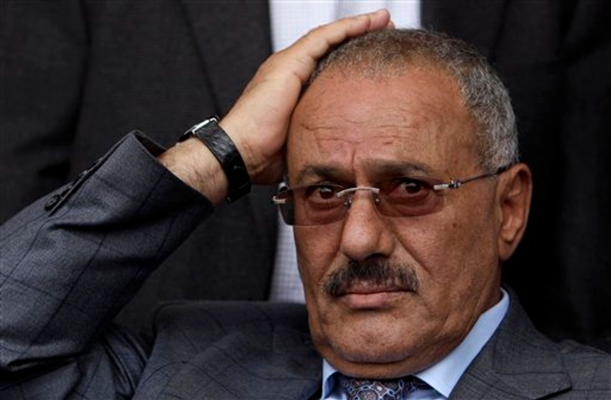 FILE - In this April 8, 2011 file photo, Yemeni President Ali Abdullah Saleh reacts while looking at his supporters, not pictured, during a rally supporting him, in Sanaa,Yemen. A government official says Yemen's president was lightly injured and four top officials wounded when opposition tribesmen struck his palace with rockets, Friday, June 3, 2011. (AP Photo/Muhammed Muheisen, File) (AP)