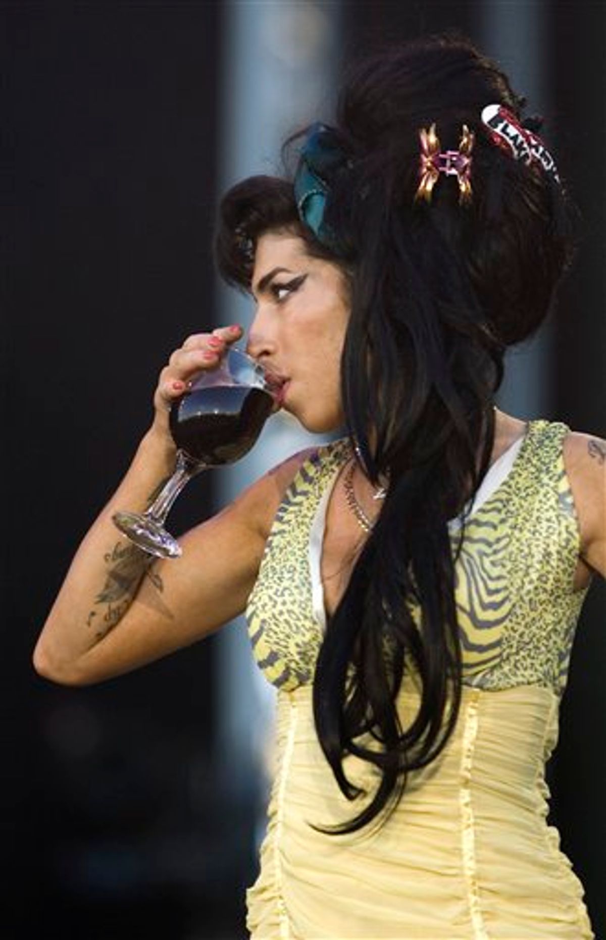 FILE - In this July 4, 2008 file photo, jazz soul singer Amy Winehouse, from England, performs during the Rock in Rio music festival in Arganda del Rey, on the outskirts of Madrid. Amy Winehouse was booed and jeered late Saturday, June 18, 2011 during a concert in Serbia's capital as she stumbled onto the stage, mumbled through her songs and wandered off. (AP Photo/Victor R. Caivano, File) EDITORIAL USE ONLY (AP)