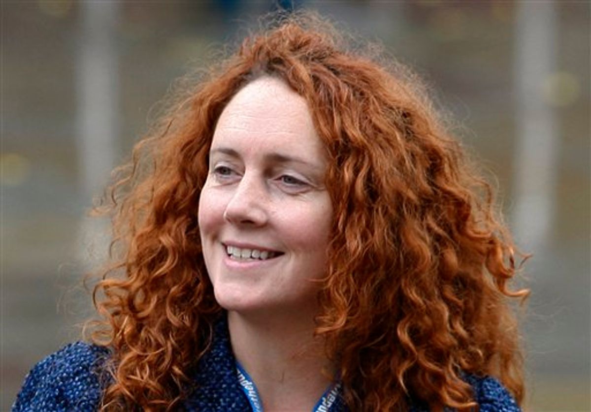 FILE - In this Oct. 6, 2009 file photo, Rebekah Brooks, chief executive of News International, which publishes the News of the World tabloid, arrives at the Conservative Party Conference in Manchester, England. Brooks resigned as Chief executive of News International Friday July 15, 2011 according to News International journalists. (AP Photo/Jon Super, File) (AP)