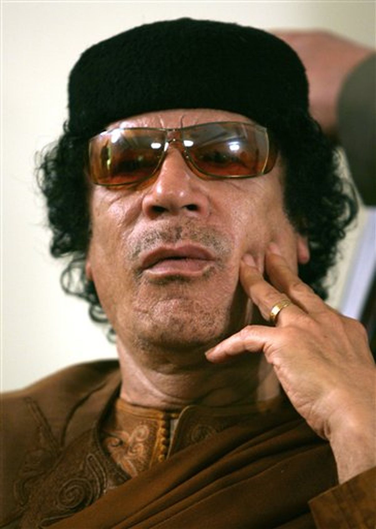 FILE.- This Friday, March 2, 2007 file photo shows Libya's Moammar Gadhafi  in Sabha, Libya Friday, March 2, 2007. The International Criminal Court issued arrest warrants Monday June 27, 2011, for Libyan leader Moammar Gadhafi, his son and his intelligence chief for crimes against humanity in the early days of their struggle to cling to power. (AP Photo/Nasser Nasser, File) (AP)