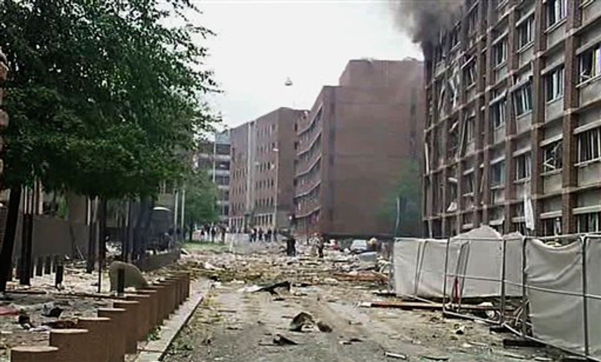 In this video image taken from television, smoke is seen billowing from a damaged building as debris is strewn across the street after an explosion in Oslo, Norway Friday July 22, 2011. A loud explosion shattered windows Friday at the government headquarters in Oslo which includes the prime minister's office, injuring several people. Prime Minister Jens Stoltenberg is safe, government spokeswoman Camilla Ryste told The Associated Press.   (AP Photo/TV2 NORWAY via APTN)   NORWAY OUT (AP)