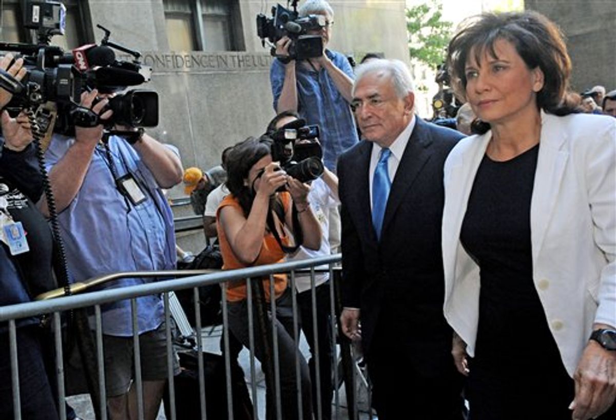 Dominique Strauss- Kahn arrives at Manhattan State Supreme court with his wife Anne Sinclair, Friday, July 1, 2011, in New York. The former International Monetary Fund leader is accused of sexually assaulting a hotel maid at Manhattan's Sofitel hotel.   (AP Photo/Louis Lanzano) (AP)