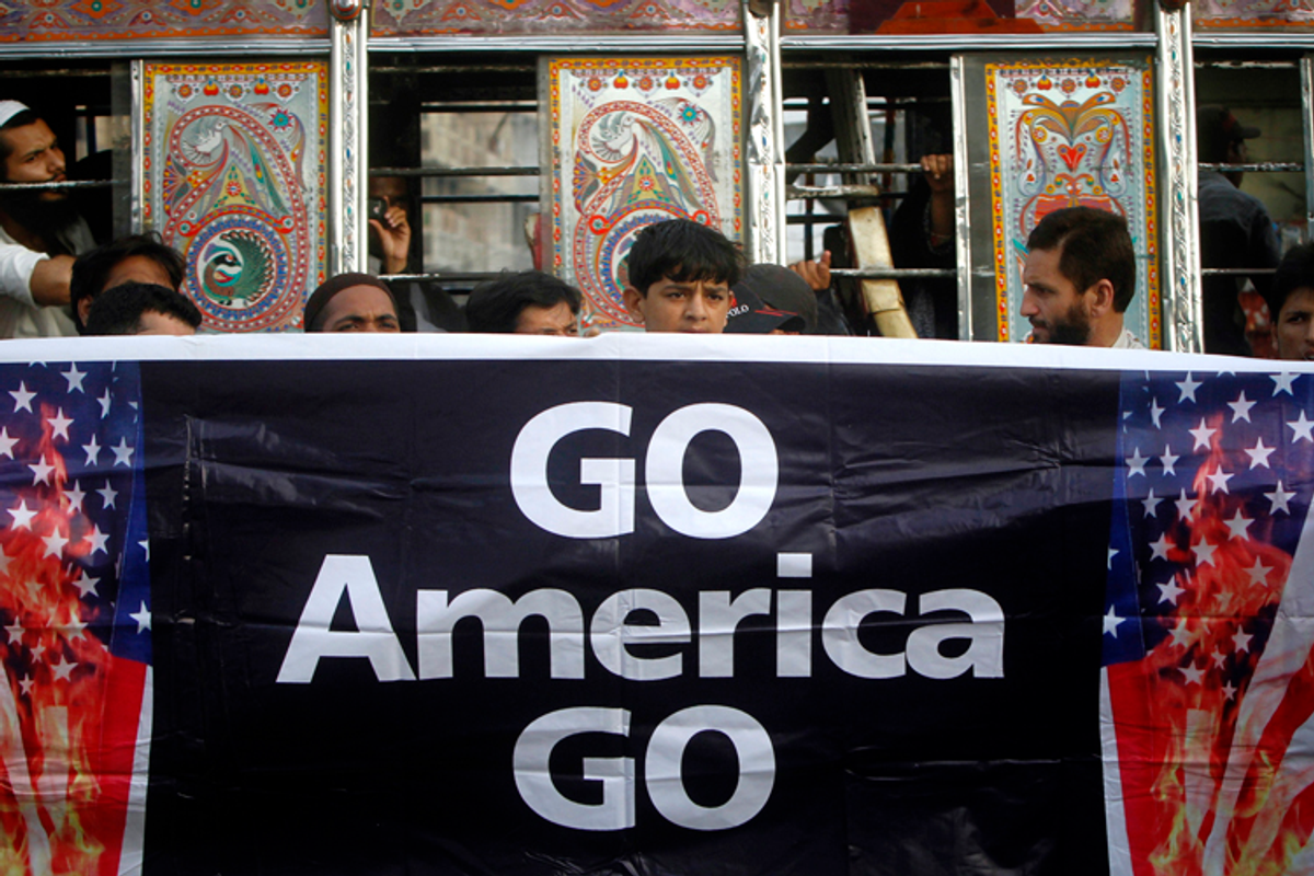Supporters of Jamaat-e-Islami hold a banner during an anti-American rally through the streets of Karachi May 6, 2011  
