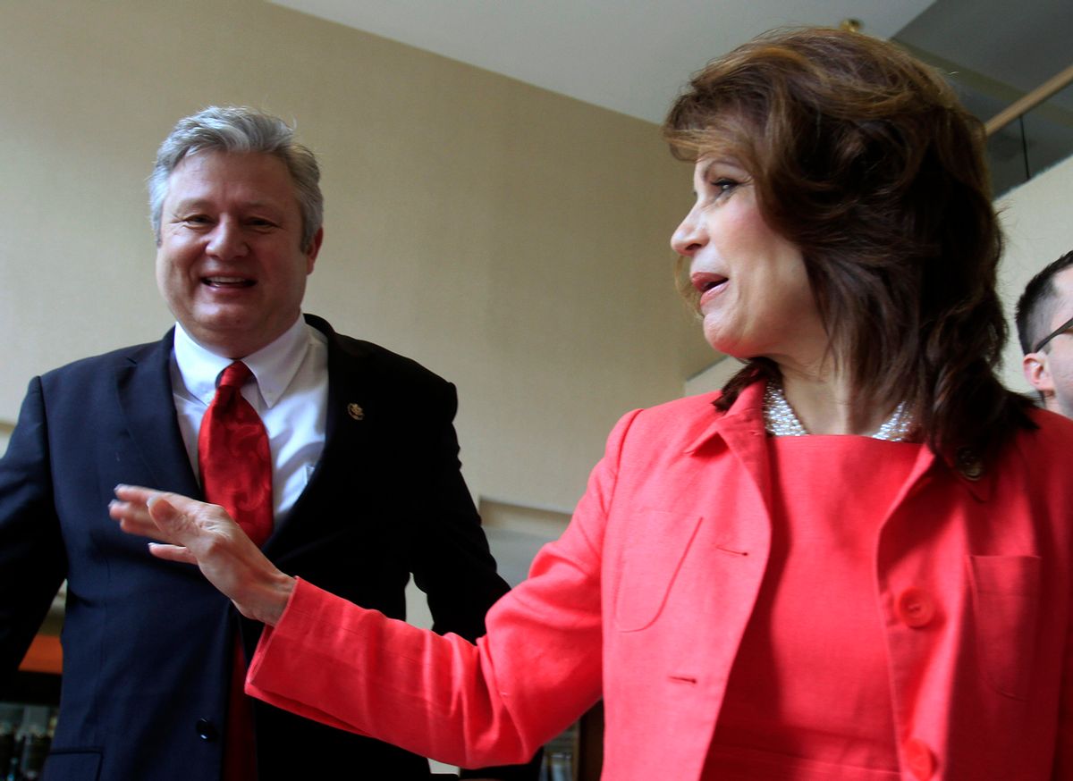 U.S. Rep. Michele Bachmann, R-Minn., arrives with her husband, Marcus, to a state GOP fundraiser Saturday, March 12, 2011 in Nashua, N.H. Bachmann recently has visited two other early nominating states and is expected to announce whether she's running for a Republican presidential nomination by early summer. (AP Photo/Jim Cole) (Jim Cole)