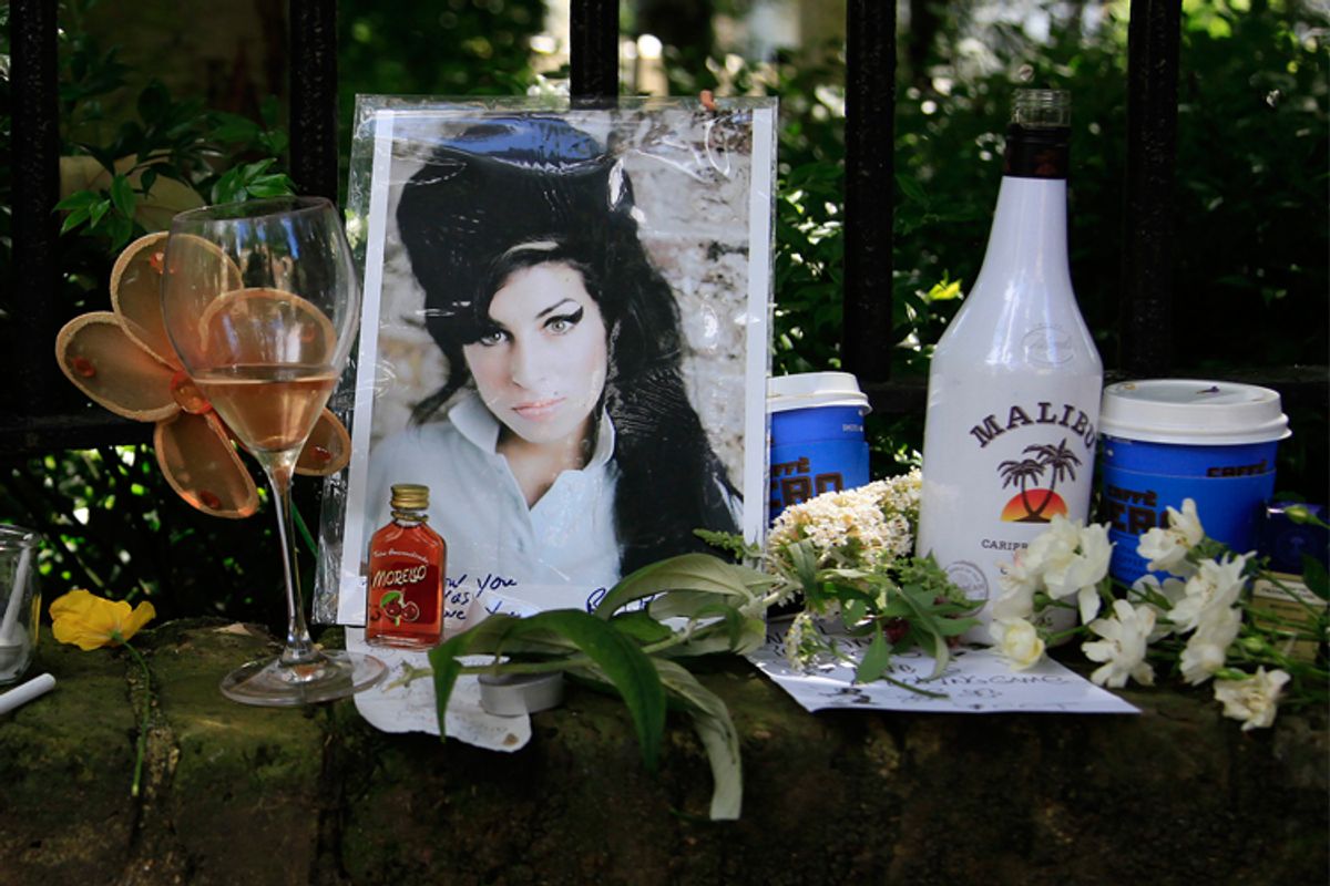 Flowers and tributes are seen outside the home of Amy Winehouse in London.