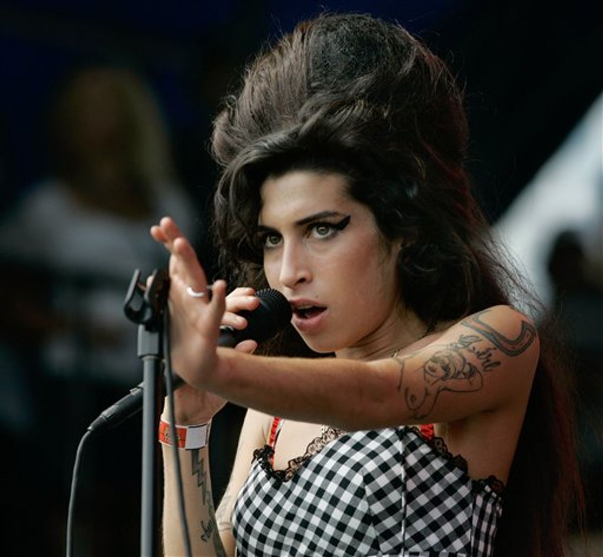 FILE - In this Aug. 5, 2007 file photo, British singer Amy Winehouse performs at Lollapalooza at Grant Park in Chicago. The singer was found dead Saturday, July 23, 2011, by ambulance crews who were called to her home in north London's Camden area. She was 27. (AP Photo/Brian Kersey, File)   (AP)