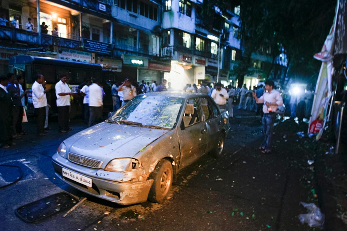 A car is seen damaged at the site of a bomb explosion in the Dadar area of Mumbai July 13, 2011. Three explosions rocked crowded districts of India's financial capital of Mumbai during rush hour on Wednesday, killing at least eight people, media said, in the biggest attack on the city since 2008 assaults blamed on Pakistan-based militants.    REUTERS/Stringer   (INDIA - Tags: CIVIL UNREST CRIME LAW)  (Â© Stringer India / Reuters)