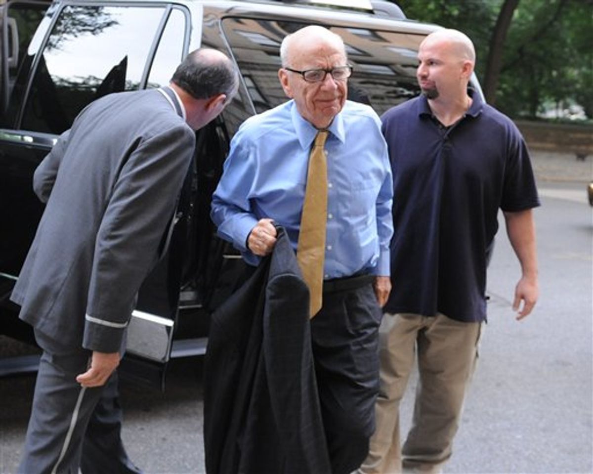 News Corporation head Rupert Murdoch arrives at his Fifth Avenue residence, Wednesday, July 20, 2011, in New York. Emerging relatively unscathed from a British parliamentary hearing on the phone hacking scandal, Rupert Murdoch returned to the United States on Wednesday, where his company faces a host of financial and legal challenges. (AP Photo/Louis Lanzano)       (AP)