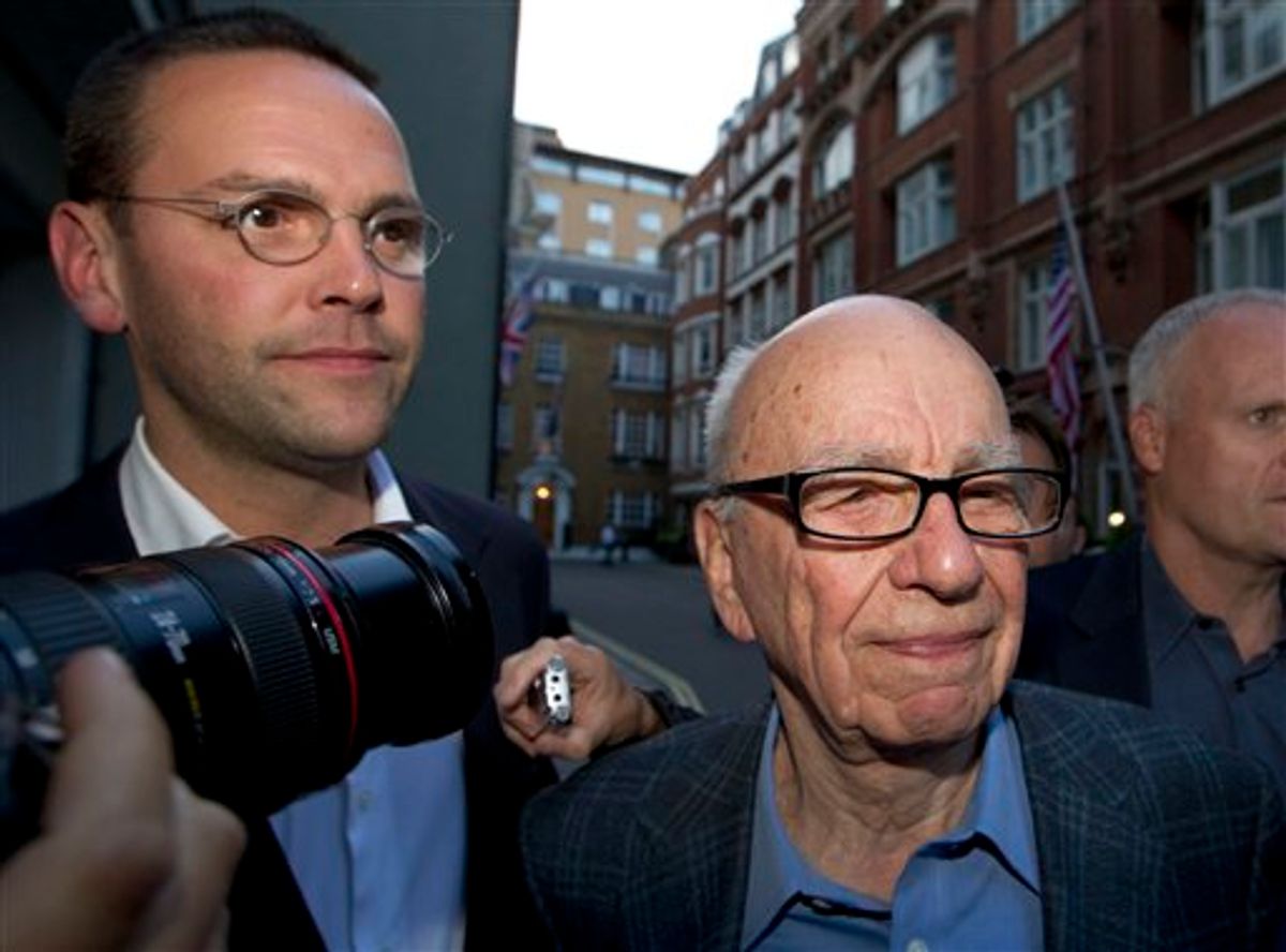 Chairman of News Corporation Rupert Murdoch, right, and his son James Murdoch, chief executive of News Corporation Europe and Asia arrive at his residence in central London, Sunday, July 10, 2011. News of the World cease publication with Sunday issue the last. News of the World is accused of hacking into the mobile phones of crime victims, celebrities and politicians. (AP Photo/Sang Tan)  (AP)