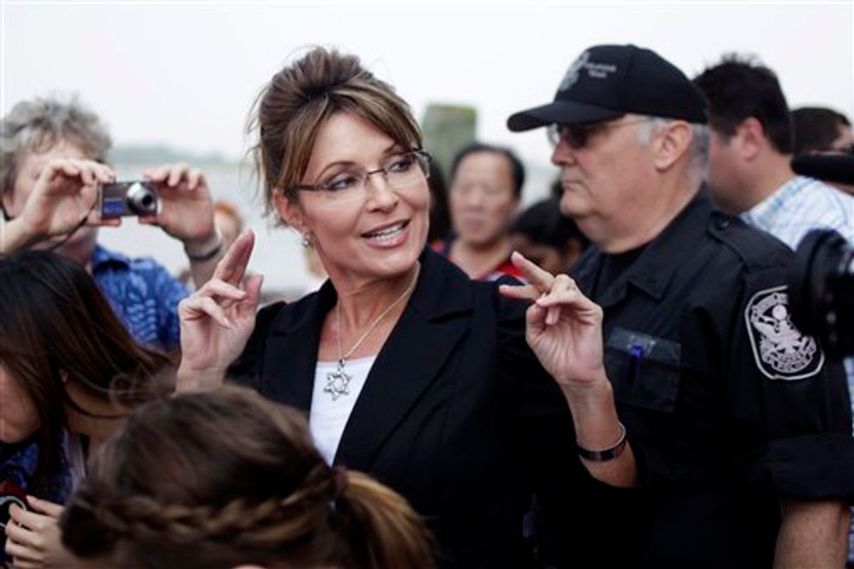 FILE - In this June 1, 2011 file photo, former Alaska Gov. Sarah Palin talks to the media as she leaves Liberty Island in New York.  Palin will visit Iowa, Tuesday, June 28, to attend the premiere of a documentary about her time as governor and her ascent as a national political figure.  (AP Photo/Seth Wenig, File) (AP)