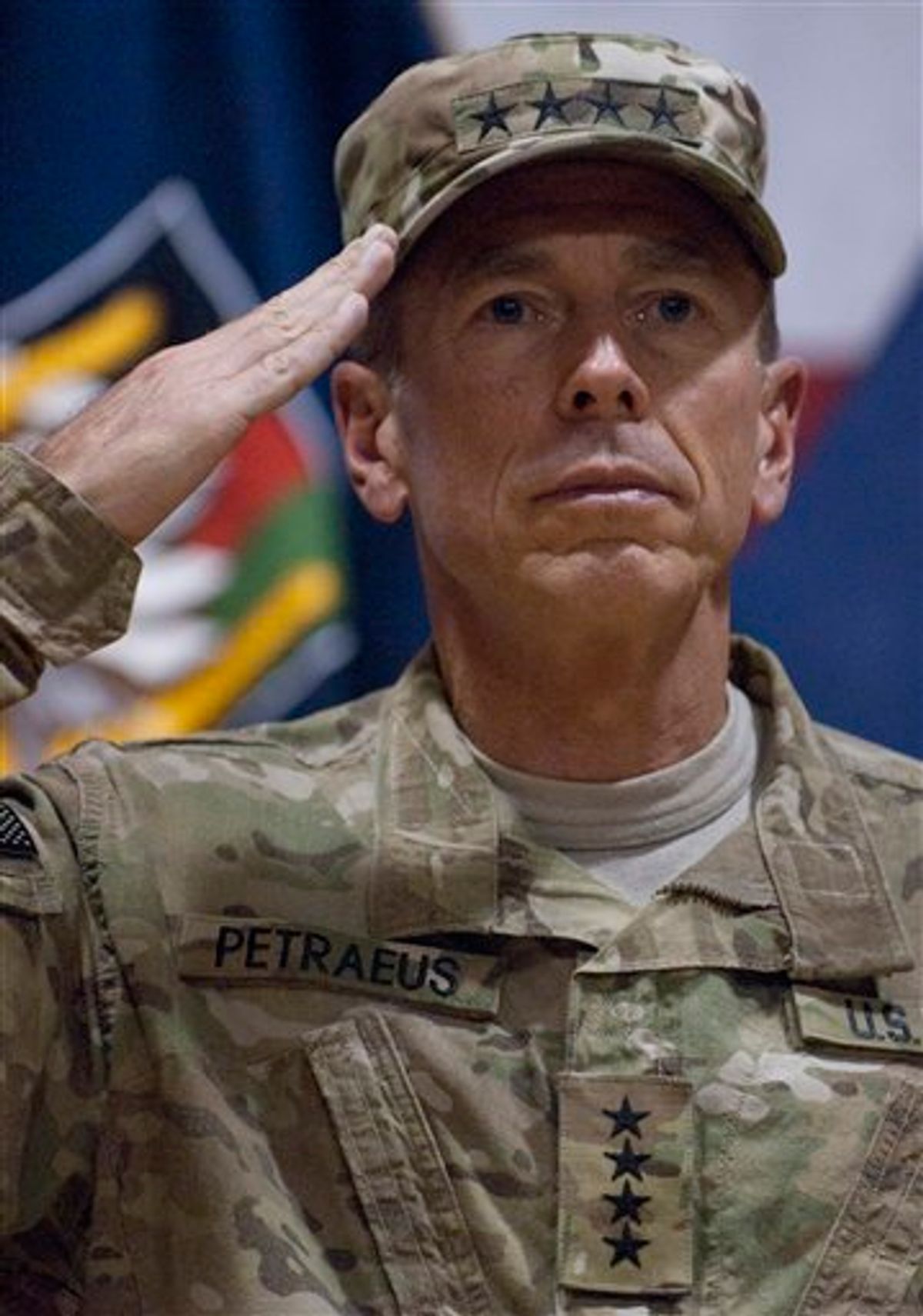 -- ADDS DAY AND DATE PHOTO WAS MADE -- In this photo provided by ISAF Regional Command (South), U.S. Army Gen. David H. Petraeus, commanding general of the NATO International Security Assistance Force (ISAF) and U.S. Forces Afghanistan (USFOR-A), salutes before administering the oath of re-affirmation and re-enlistment to 235 U.S. service members during a ceremony called "Operation Enduring Commitment - The Red, White and True," held at Kandahar Airfield in Kandahar, Afghanistan, Monday July 4, 2011. (AP Photo/ U.S. Navy Lt. j.g. Haraz N. Ghanbari)   (AP)