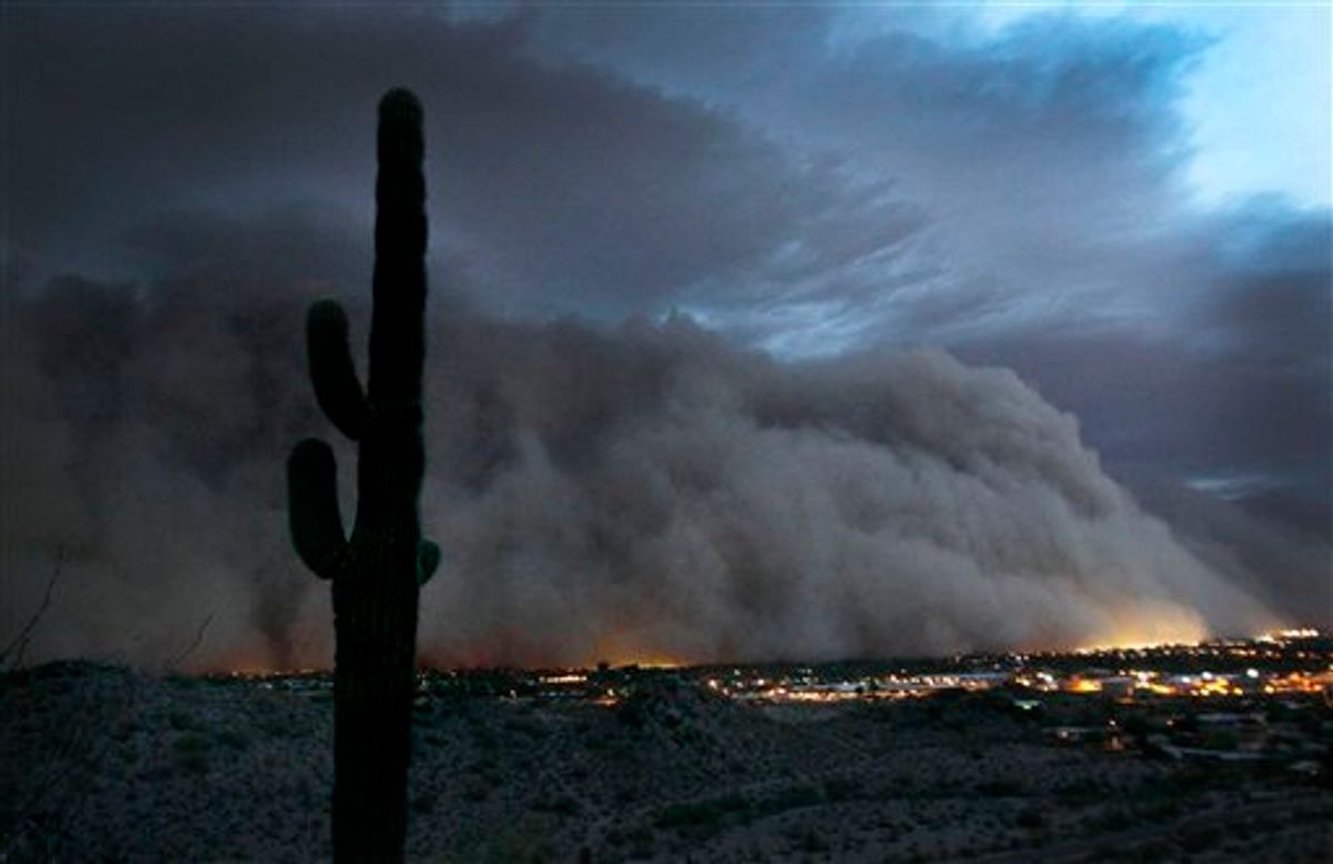 A giant dust storm covers Phoenix, Ariz., Tuesday, July 5, 2011. (AP Photo/The Arizona Republic, Rob Schumacher) (AP)