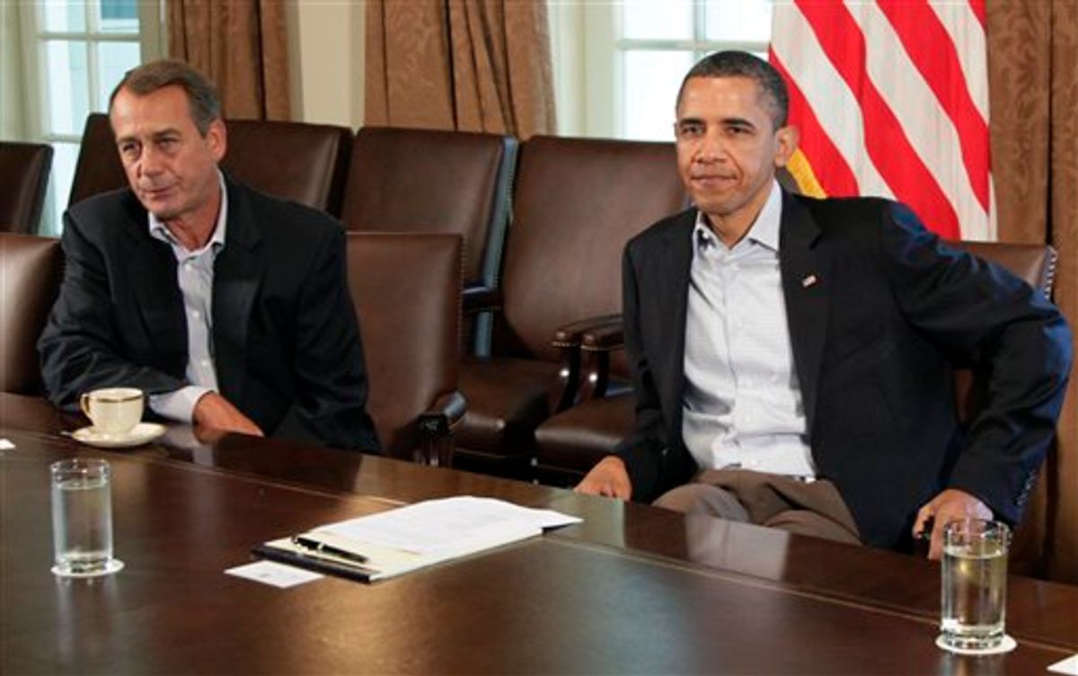 President Barack Obama sits next to House Speaker John Boehner of Ohio, left, in the Cabinet Room of the White House, Saturday, July 23, 2011, in Washington, as they meet to discuss the debt. (AP Photo/Carolyn Kaster)  (AP)