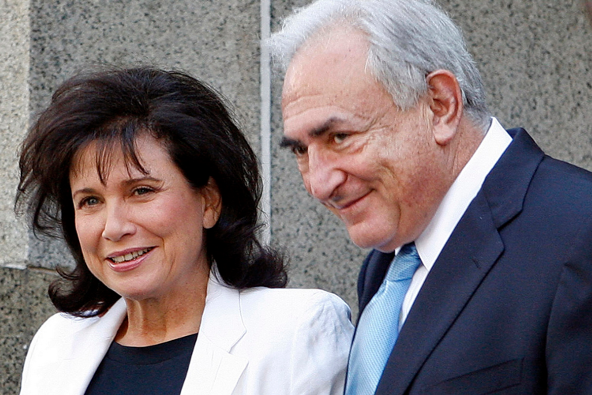Former International Monetary Fund leader Dominique Strauss-Kahn leaves the New York State Supreme Court with his wife, Anne Sinclair, on July 1, 2011.