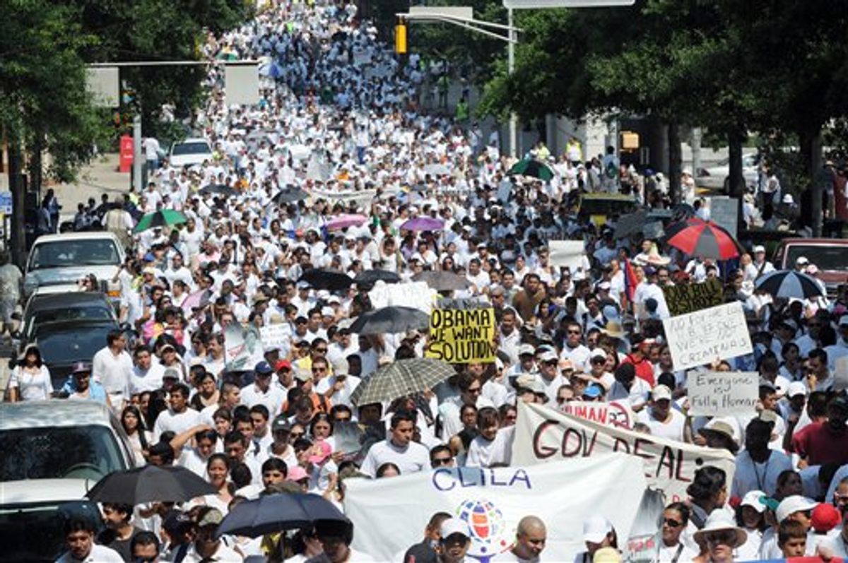 Thousands of people march through downtown Atlanta in protest against Georgia's strict new immigration law on Saturday, July 2, 2011 in Atlanta. On Monday, a Federal judge temporarily blocked parts of the law. One provision that was blocked authorizes police to check the immigration status of suspects without proper identification. It also authorizes them to detain illegal immigrants. (AP Photo/Erik S. Lesser)      (AP)