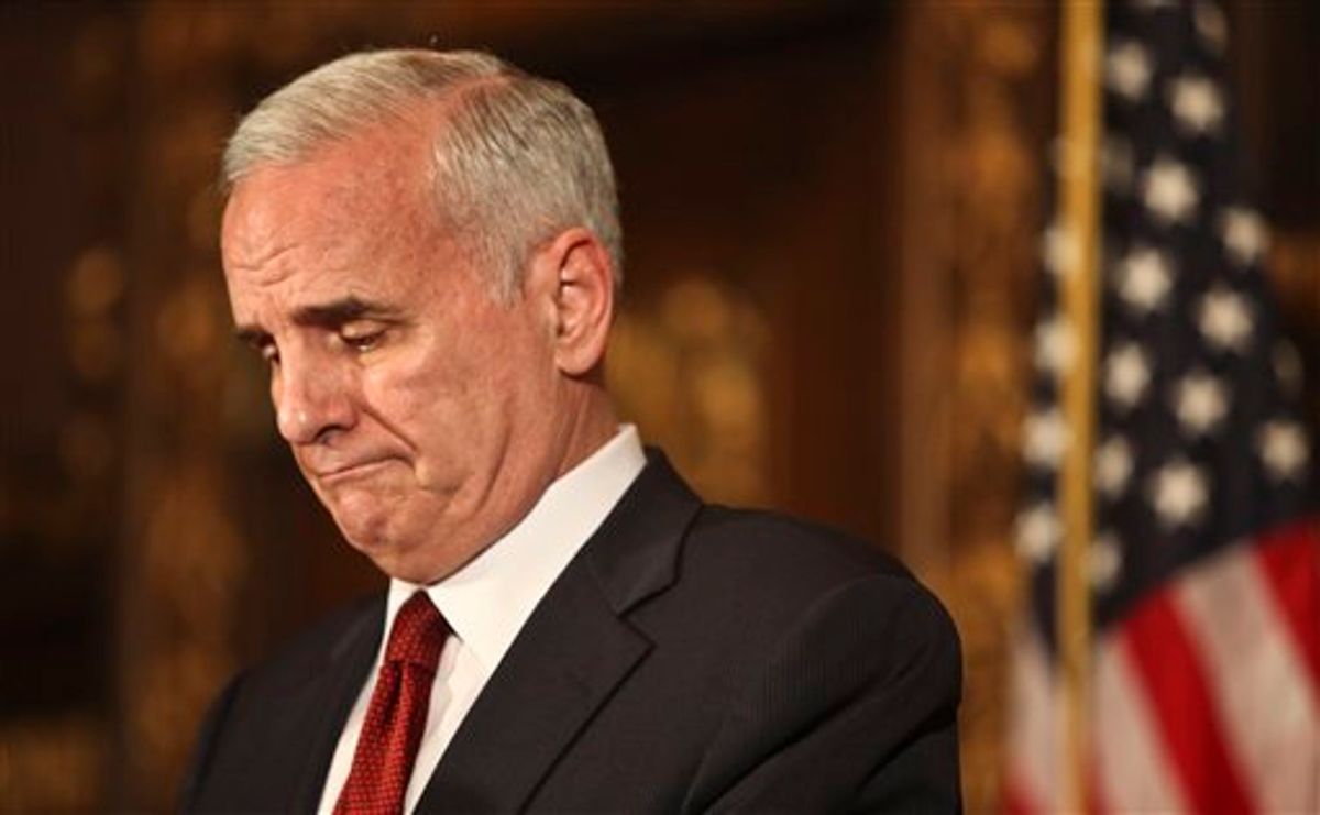 Gov. Mark Dayton addressed the media and some Republicans that were present as he said that the two sides were still not closeat the state capitol an hour left until a government shutdown. Minnesota state government shut down at 12:01 a.m. CDT Friday July 1, 2011 for the second time in six years after political leaders couldn't agree on how to solve a $5 billion budget deficit. (AP Photo Kyndell Harkness - STAR TRIBUNE) MANDATORY CREDIT   (AP)