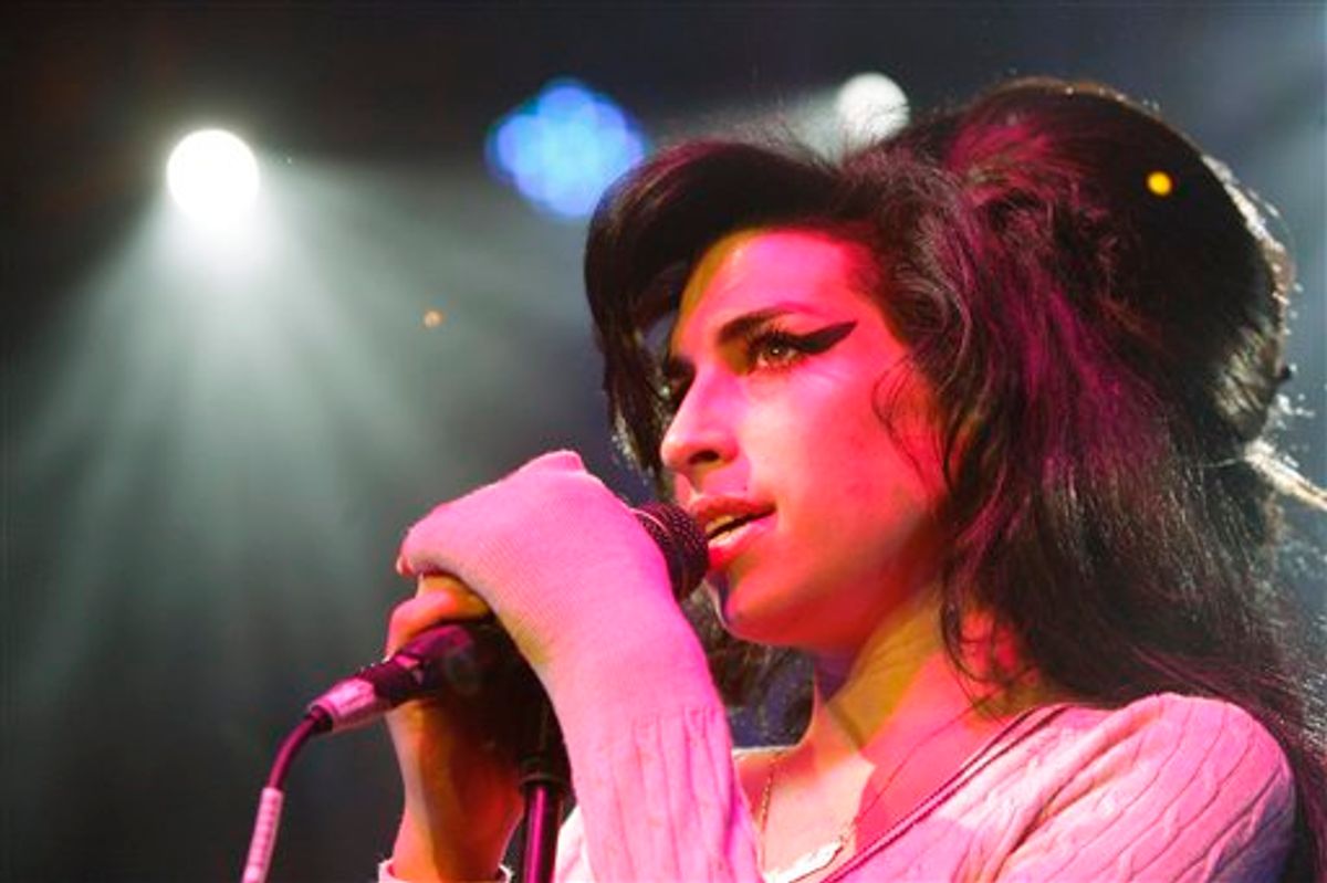 FILE - In this Oct. 25, 2007 file photo, British singer Amy Winehouse performs during her concert at the Volkshaus in Zurich, Switzerland. Winehouse was found dead Saturday, July 23, 2011, by ambulance crews who were called to her home in north London's Camden area. She was 27. (AP Photo/Keystone, Steffen Schmidt, File)    (AP)