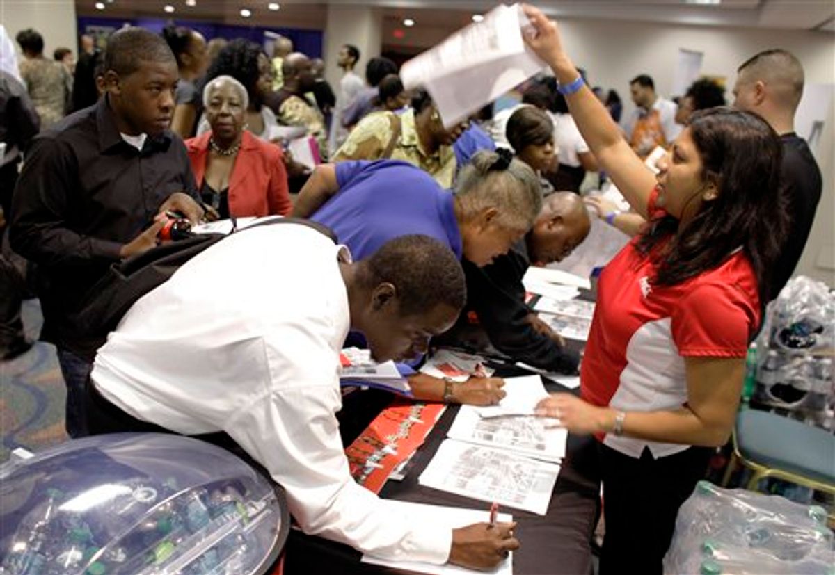 Coca-Cola employee Farrah Deonarine of Weston, Fla., right, passes out forms at a jobs fair hosted by the Congressional Black Caucus in Miami, Tuesday, Aug. 23, 2011. The fair is aimed at lowering the especially high rate of unemployment in the black community.  (AP Photo/Lynne Sladky) (AP)