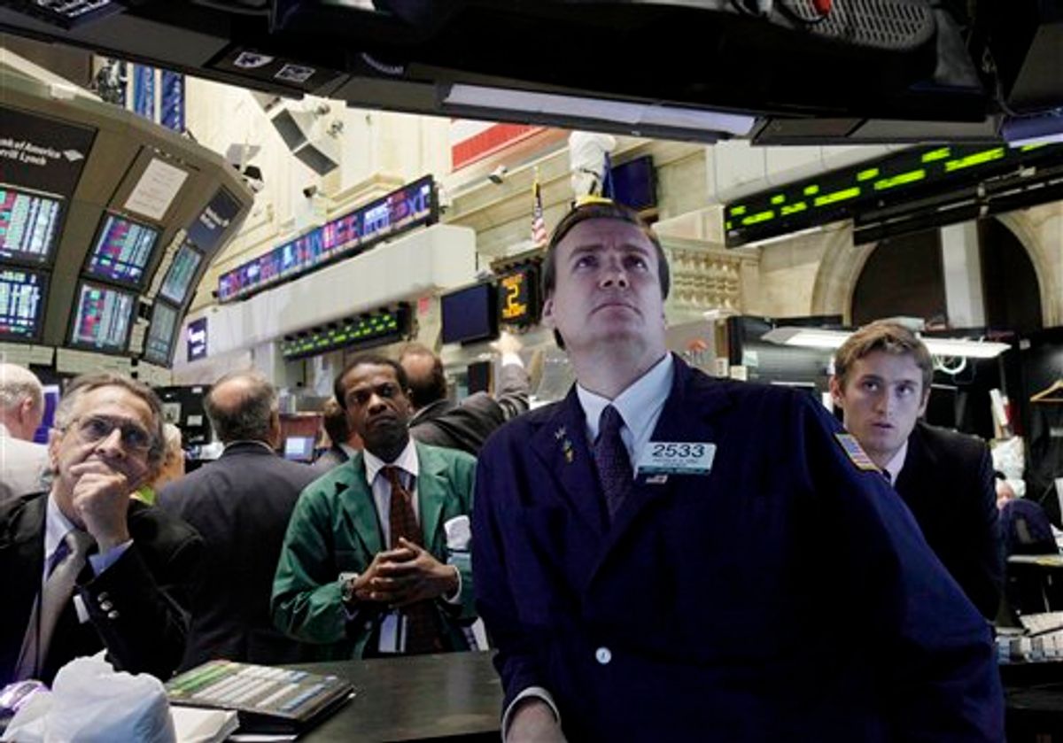 Specialist Patrick King, second from right, and others watch President Barack Obama's remarks on a television monitor the floor of the New York Stock Exchange Tuesday, Aug. 2, 2011. The stock market stumbled again Tuesday and is on pace for its longest losing streak in two years.(AP Photo/Richard Drew) (AP)