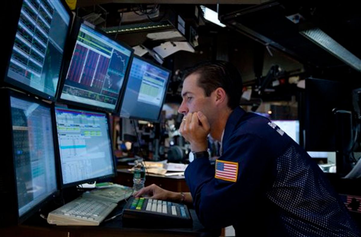 In this Aug. 4, 2011 photo, a trader works on the floor of the New York Stock Exchange. Global stock markets tumbled Friday, Aug. 5, amid fears the U.S. may be heading back into recession and Europe's debt crisis is worsening. The sell-off follows the biggest one-day points decline on Wall Street since the 2008 financial crisis. (AP Photo/Jin Lee) (AP)