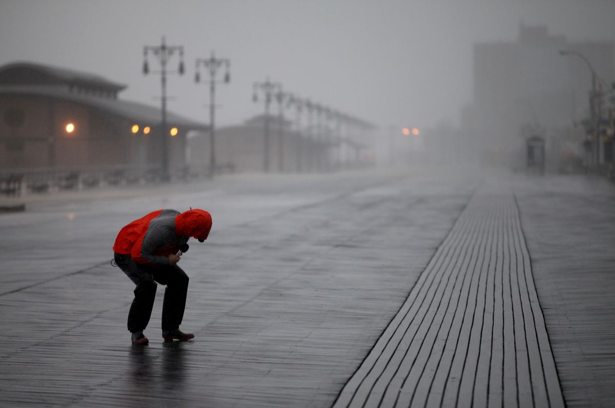 NBC reporter Peter Alexander attempts to broadcast from the windswept Coney Island boardwalk in New York as Hurricane Irene became intensified Sunday, Aug. 28 2011 in Coney Island section of  New York. (AP Photo/Craig Ruttle (Craig Ruttle)