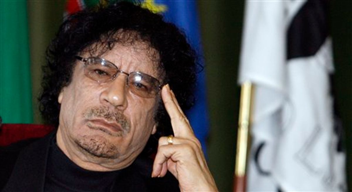FILE -- In a Dec. 7, 2007 file photo Libyan leader Moammar Gadhafi gestures while speaking during media conference at the University of Lisbon, in Lisbon,  Libyan rebels took control of most of Tripoli in a lightning advance Sunday, Aug. 21, 2011, but the leader's whereabouts were unknown and pockets of resistance remained.  (AP Photo/Paulo Duarte/file)  (AP)