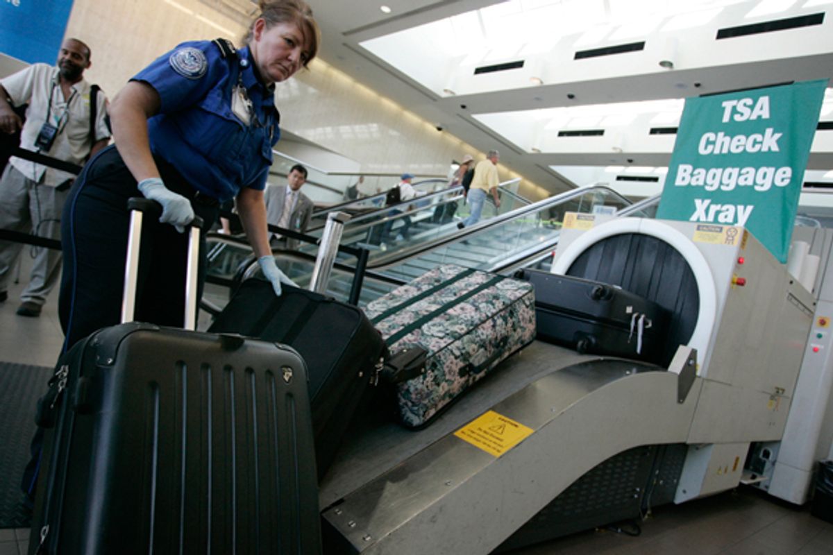 In this Aug. 3, 2011 photo, airline passengers go through the Transportation Security Administration security checkpoint at Hartsfield-Jackson Atlanta International Airport, in Atlanta. The TSA was created after the terrorist attacks of Sept. 11, 2001. (AP Photo/Erik S. Lesser) (AP)