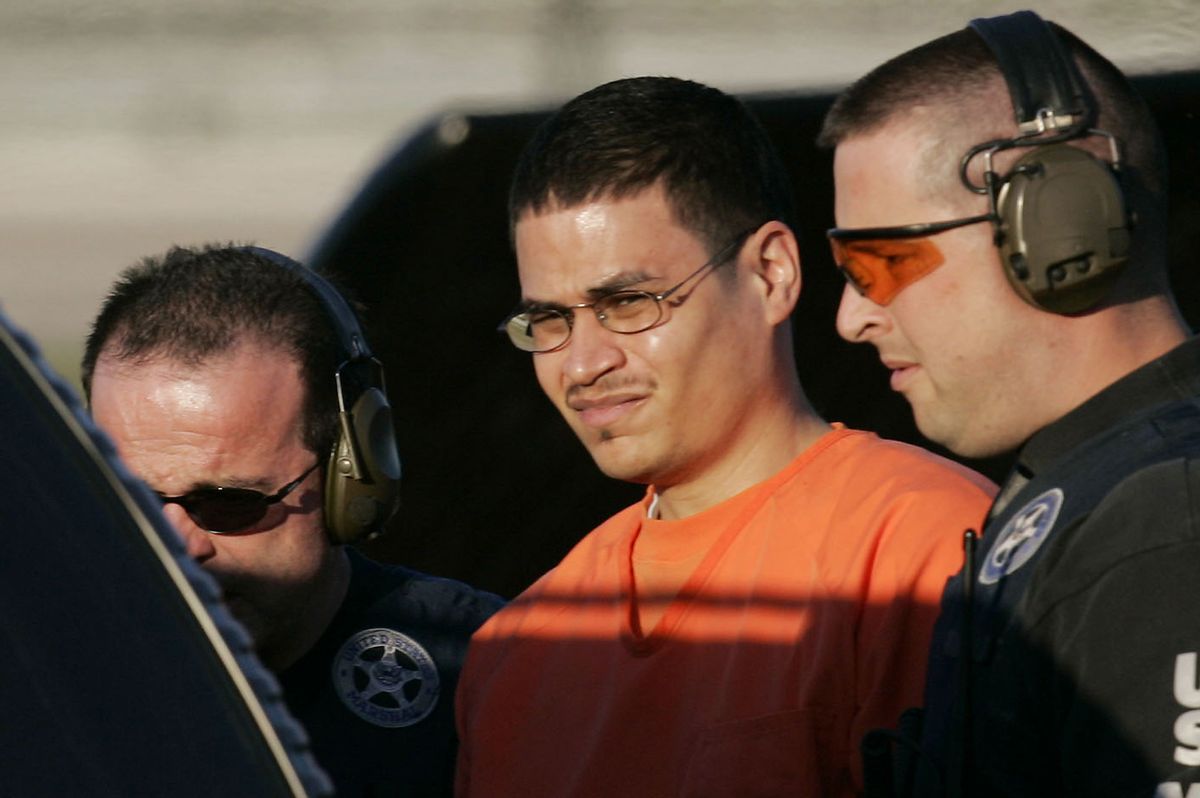** TO GO WITH PADILLA JUICIO ** **  FILE  **  Jose Padilla, center, is escorted to a waiting police vechicle by federal marshals near downtown Miami in this Jan. 5, 2006, file photo. The Bush administration's decision to charge alleged al-Qaida operative Jose Padilla in civilian court resolved one major legal challenge to the president's ability to hold people without charge in the war on terror. But things have not gone smoothly since, with Padilla and his defendants filing dozens of motions seeking access to government secrets and overseas terror detainees and poking holes in the evidence itself. Trial has already been delayed once and now, four months before the case is supposed to go before a jury, it appears to be anything but a slam dunk for the government. (AP Photo/J. Pat Carter) (Associated Press)