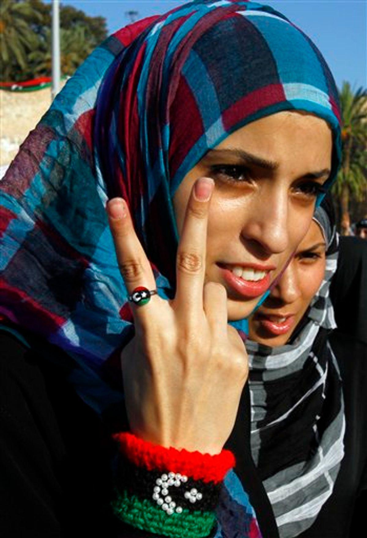 Libyan woman gives the V sign at the Green Square, renamed Martyr's Square for the morning Eid prayer, marking the end of Ramadan and to celebrate their victory over embattled Moammar Gadhafi, inTripoli, Libya, Wednesday, Aug. 31, 2011. (AP Photo/Francois Mori) (AP)